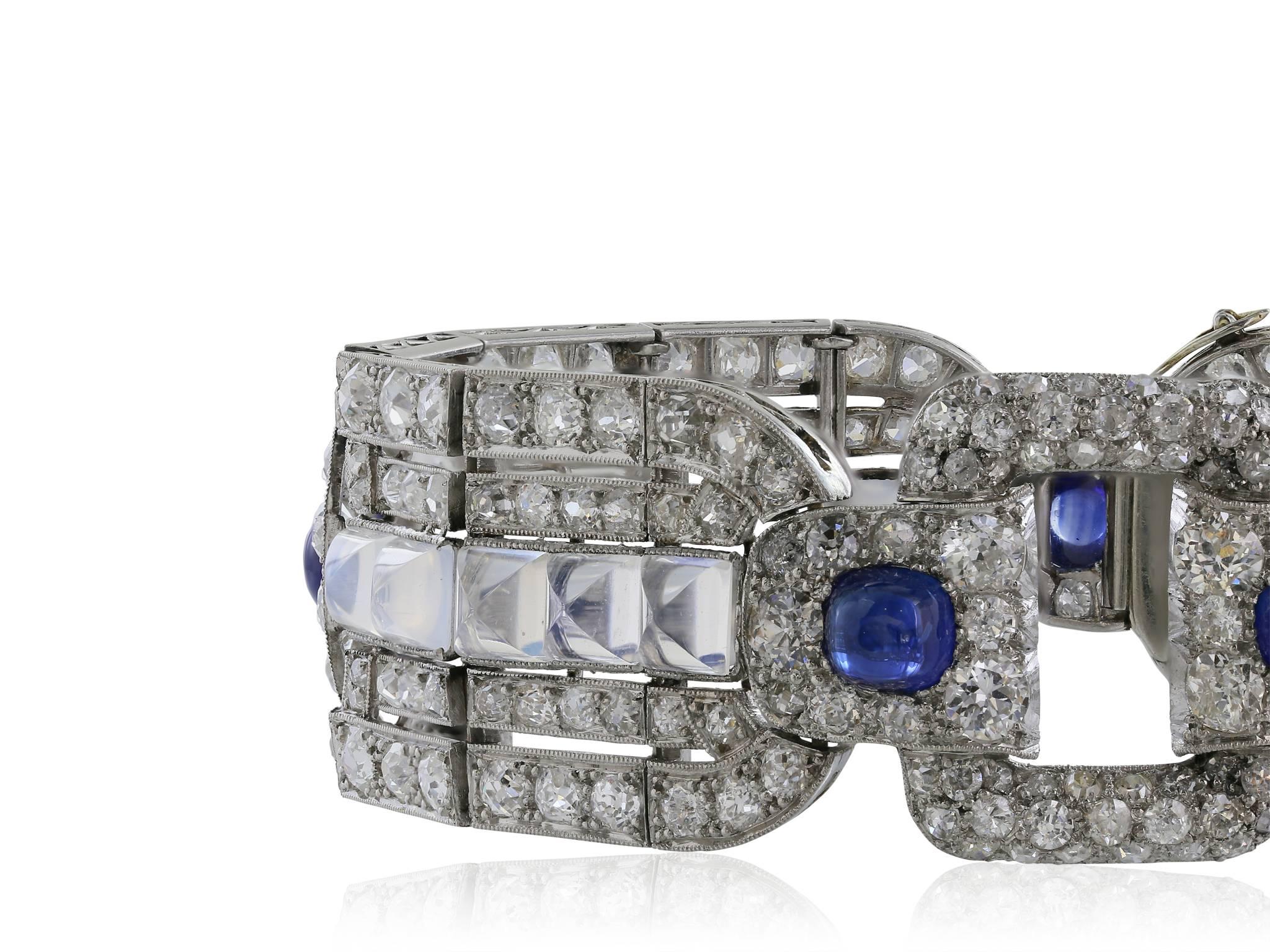 Platinum custom Art Deco bracelet consisting of Old European cut diamonds with an approximate weight of 15 carats set in intricate open work pattern, with 5 cabochon cut sapphires and 20 cabochon cut moonstones.
