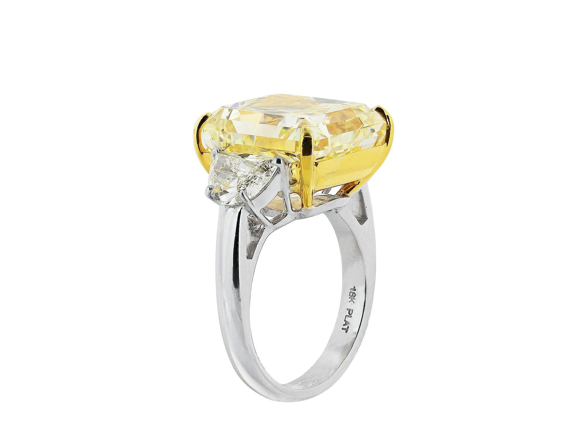 Shreve, Crump & Low custom made, platinum and 18 karat yellow gold, three stone style engagement ring consisting of 1 radiant cut canary diamond, weighing 20.24 carats, measuring 15.81 x 14.40 x 9.62 mm, having a color and clarity of Fancy Intense