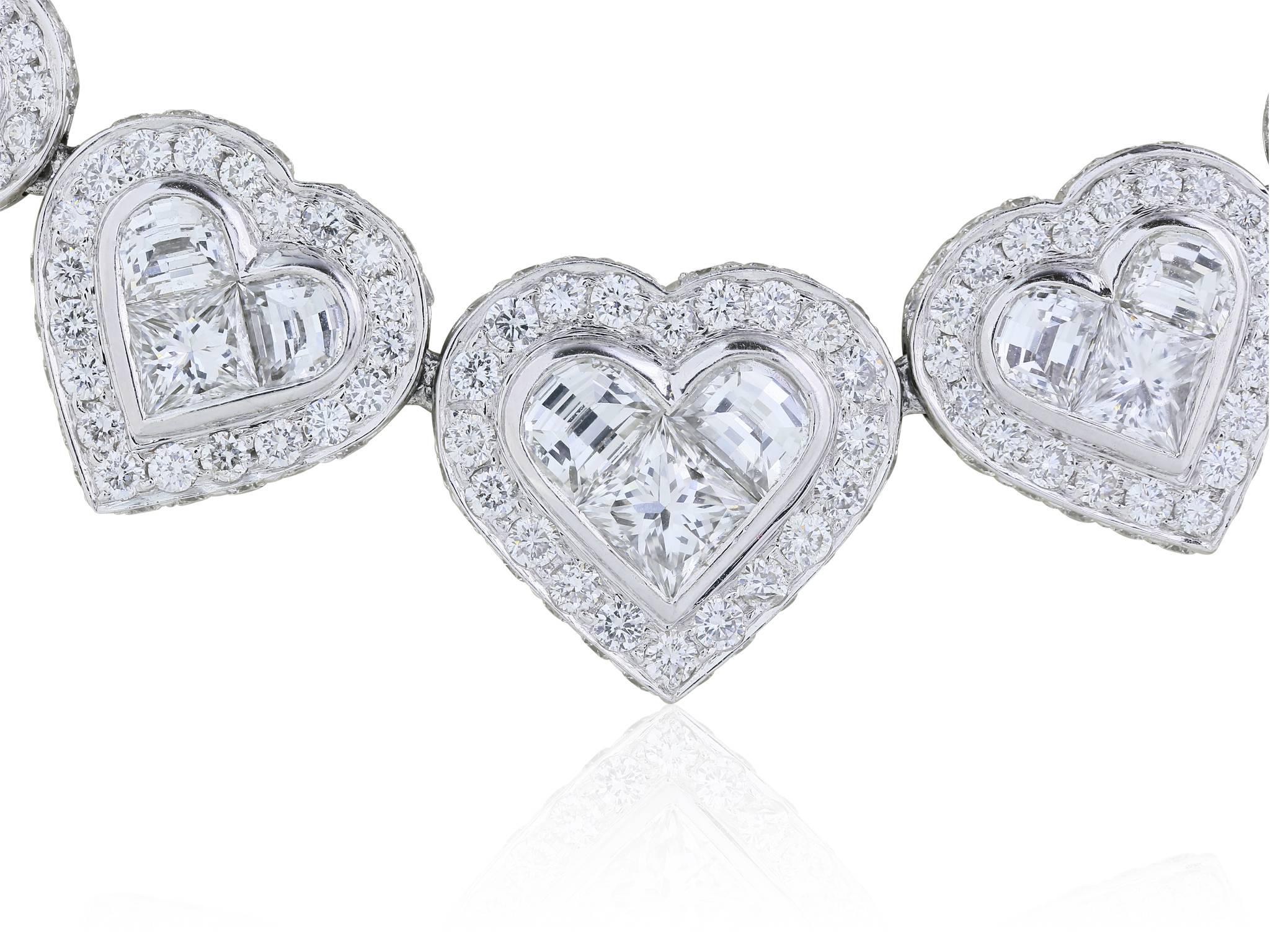 Platinum graduated heart shaped diamond Riviera necklace consisting of princess, round, and half moon cut diamonds with a total weight of 35.03 carats with a color and clarity of F VS1-VS2 respectively.

