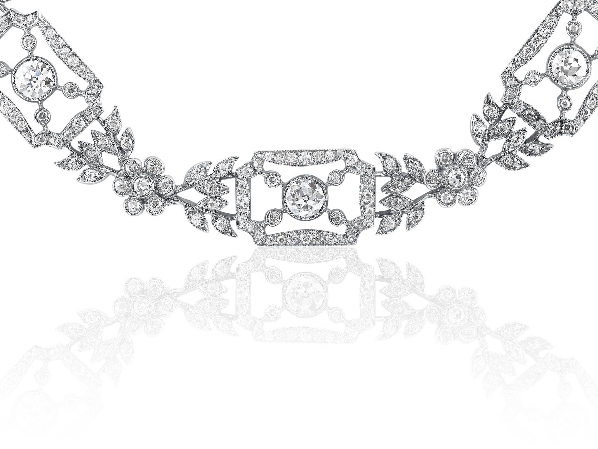 Platinum and diamond open work vintage style necklace consisting of approximately 20.50 carats total weight of round brilliant cut diamonds having a color and clarity of G/H VS. the necklace is 23 1/2 inches.