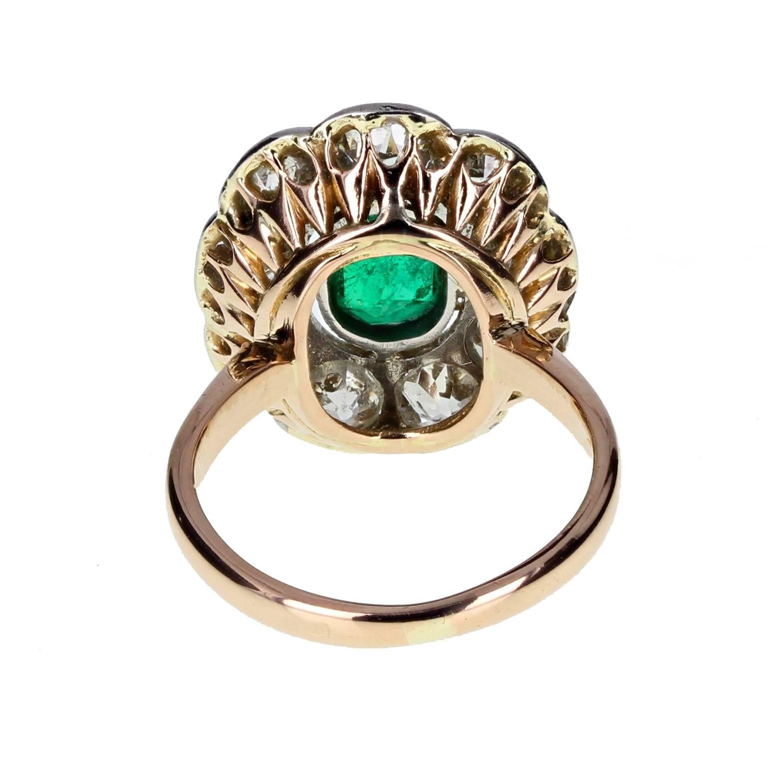 Edwardian Antique Oval Emerald and Diamond Cluster Ring in Gold
