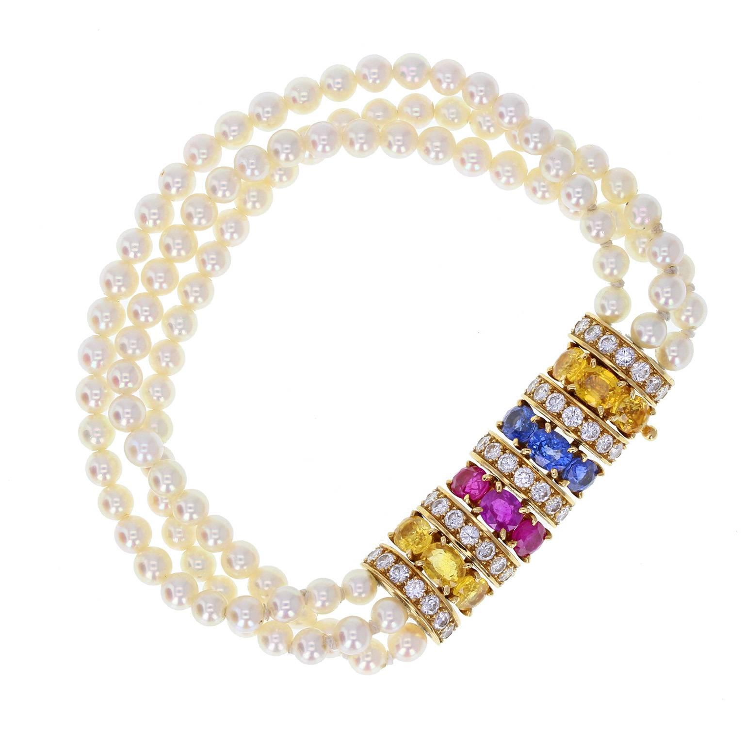 A stunning vintage parure by Van Cleef & Arpels Paris, comprising a bracelet, necklace and pair of earrings. Necklace and bracelet in the form of three rows of cultured, saltwater pearls, gently graduating from 4 to 4.5mm, terminating at a
