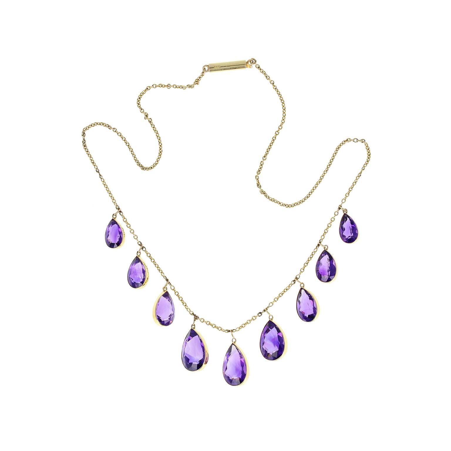 A favourite of the Victorians, this lovely necklace features some rather wonderful amethysts, nine in total, all perfectly matched in colour and slightly graduating in size. Suspended in fixed positions along a fine belcher-style 15ct gold chain.