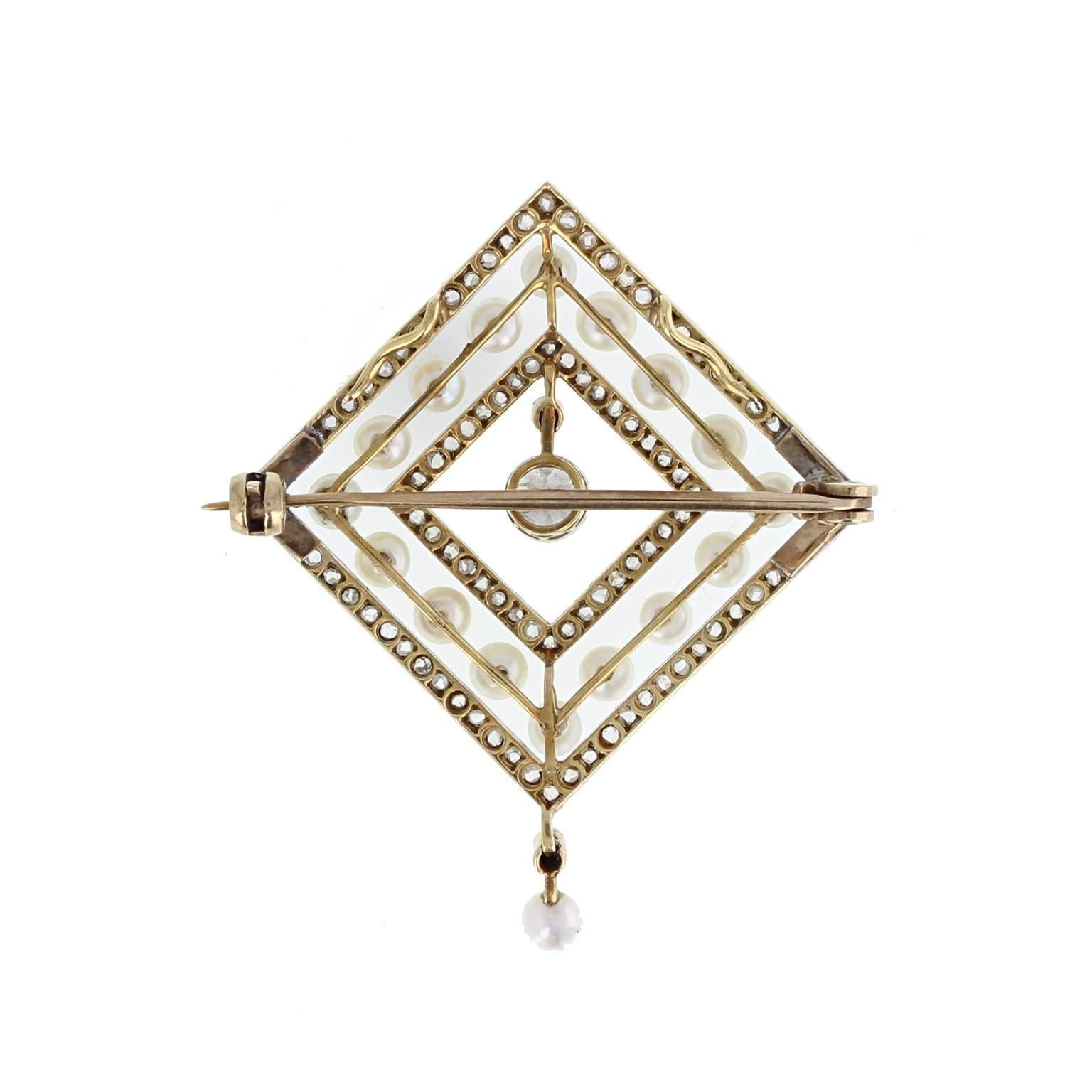 A wonderful brooch circa late 1912. A single transition-cut diamond of approximately 0.30 of a carat at the centre, in a mille-grain edged setting. Surrounded by three alternating squares of rose-cut diamonds and pearls. A single pearl and diamond