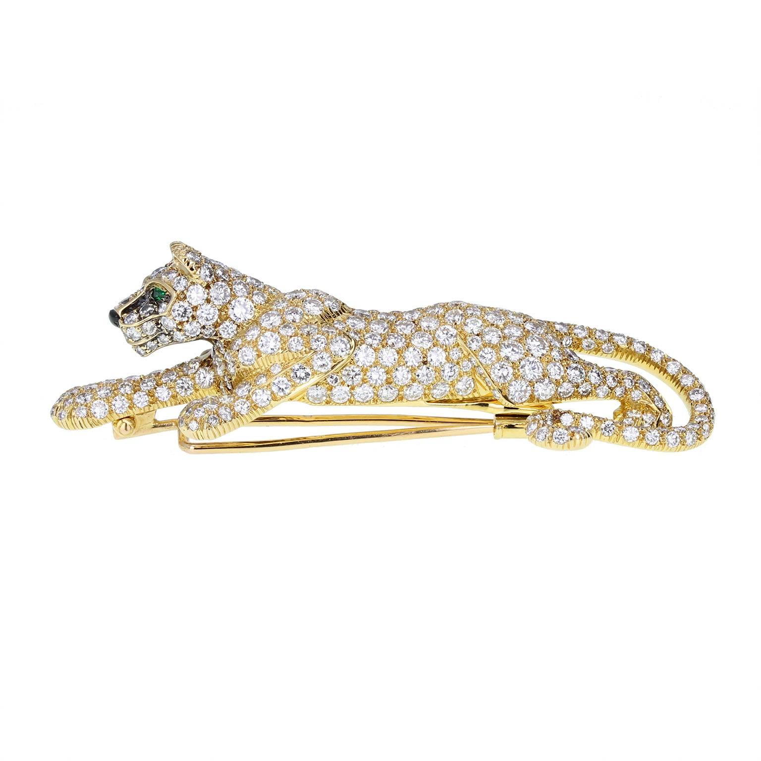 An iconic, instantly recognisable piece by Cartier. The eponymous panther brooch, impossibly detailed, of exceptional quality and coveted by jewellery lovers across the globe. 18ct gold, pavé-set with brilliant-cut diamonds. Marquise-cut emerald