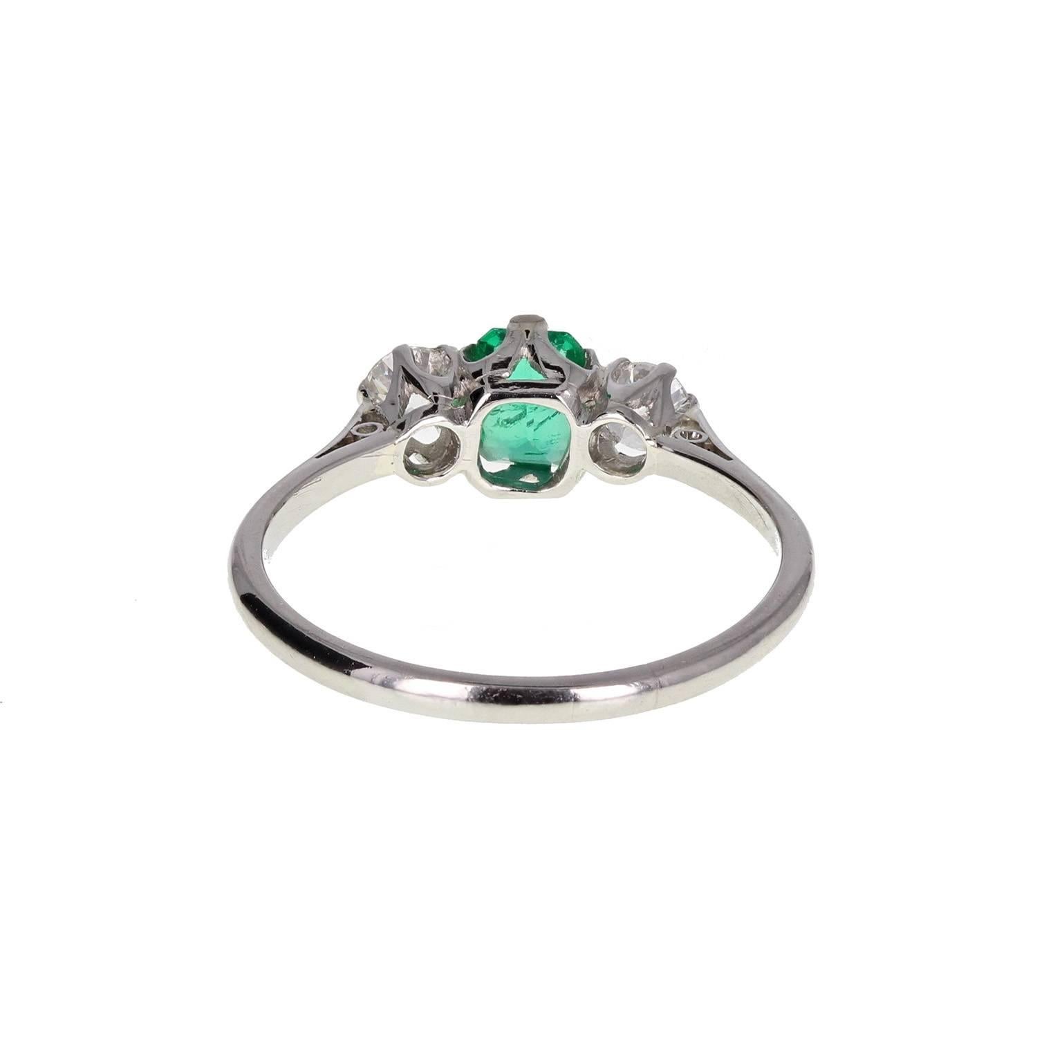 Modern Emerald Diamond Platinum Three Stone Ring