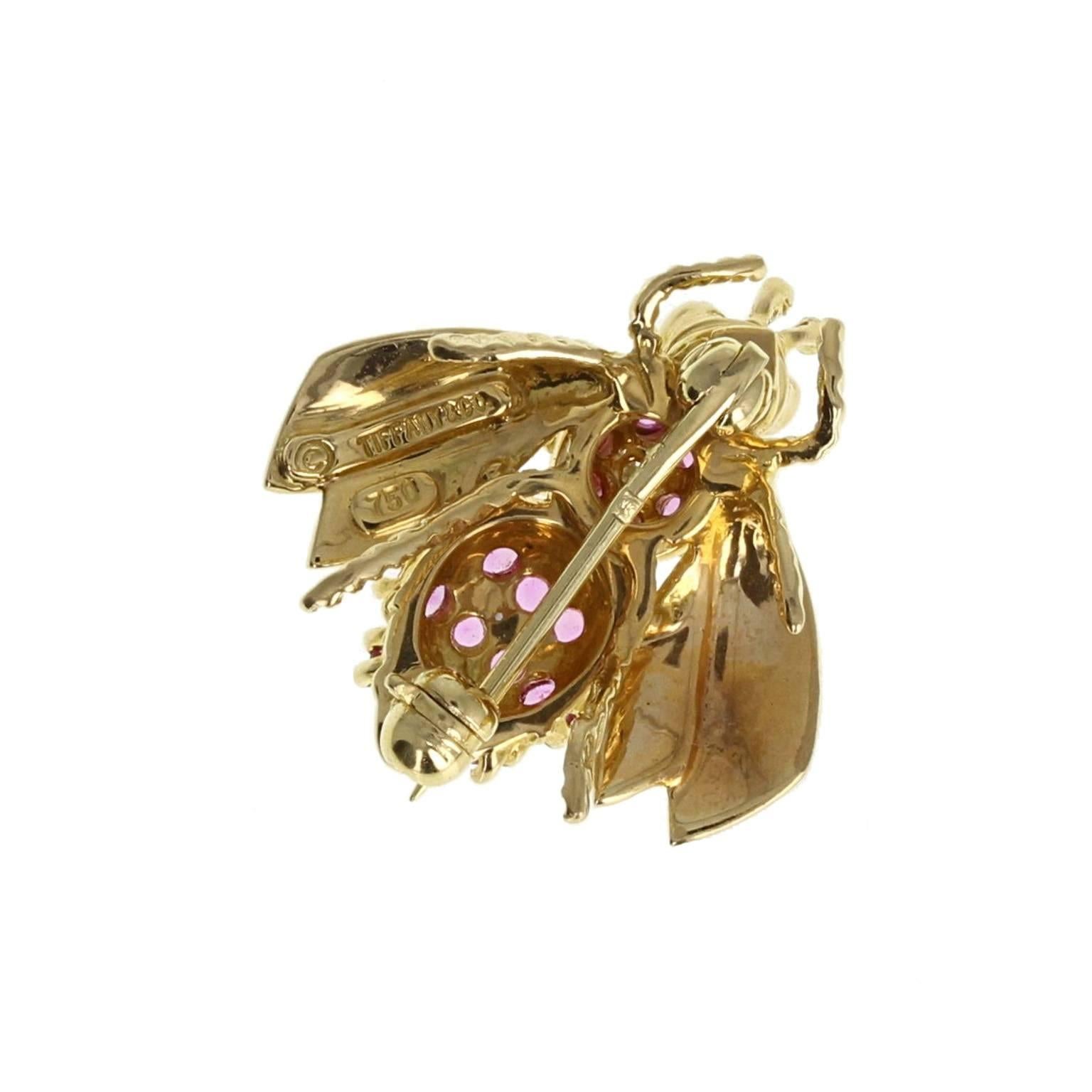 A tiny, beautifully formed bee brooch, set with a single brilliant-cut diamond, pink sapphires and two rubies for eyes. Signed Tiffany & Co.
 
Setting
Tests as 18 carat gold
 
Diamond
Weight: 0.10 of a carat
Clarity: VS
Colour: G
