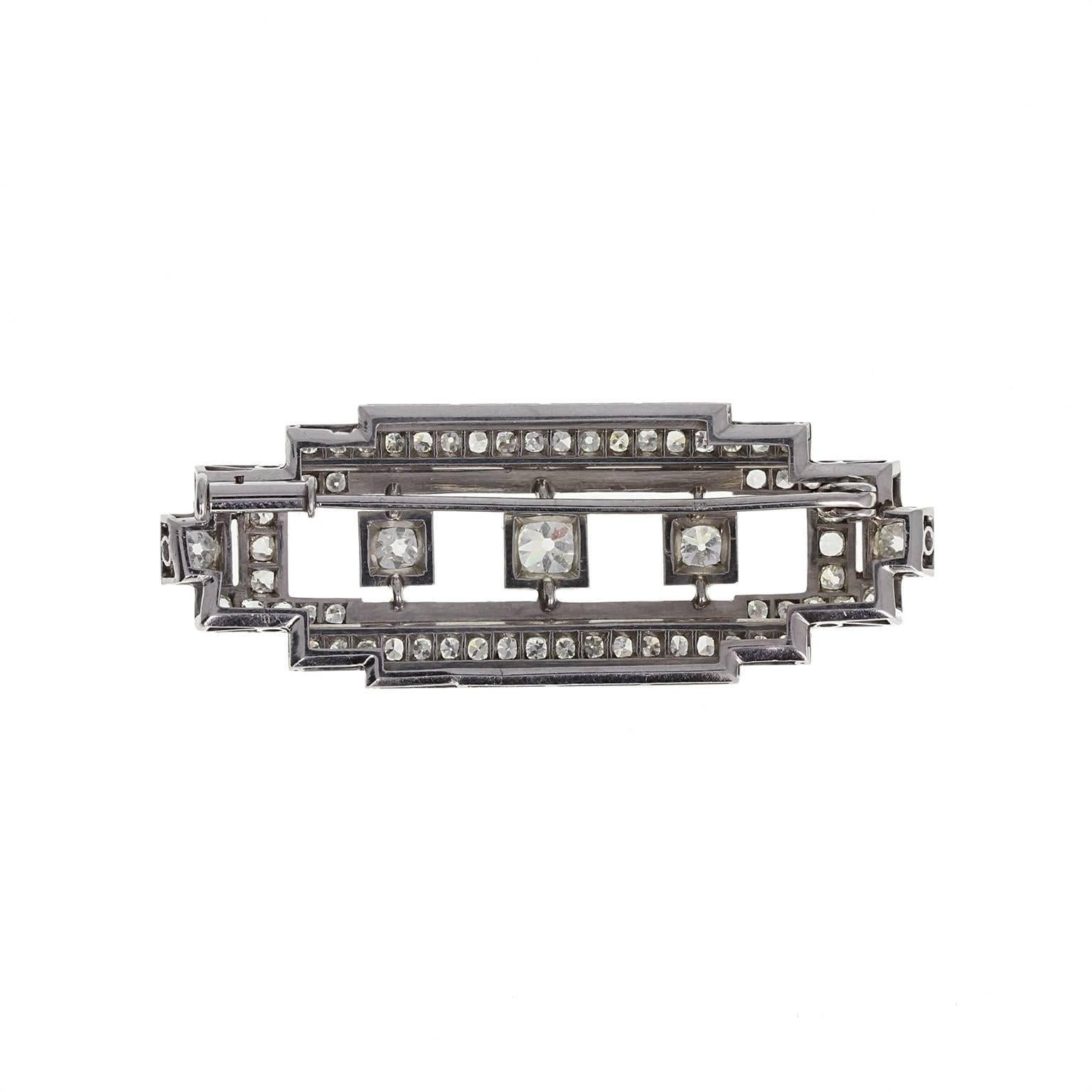A rampant Art Deco brooch fashioned from platinum in the typical period geometric style. Set with old-cut diamonds. The epitome of 1920s jewellery style.
 
Setting
Tests as platinum
 
Diamond
Weight: 3.00 carats in total, approximately
Clarity: