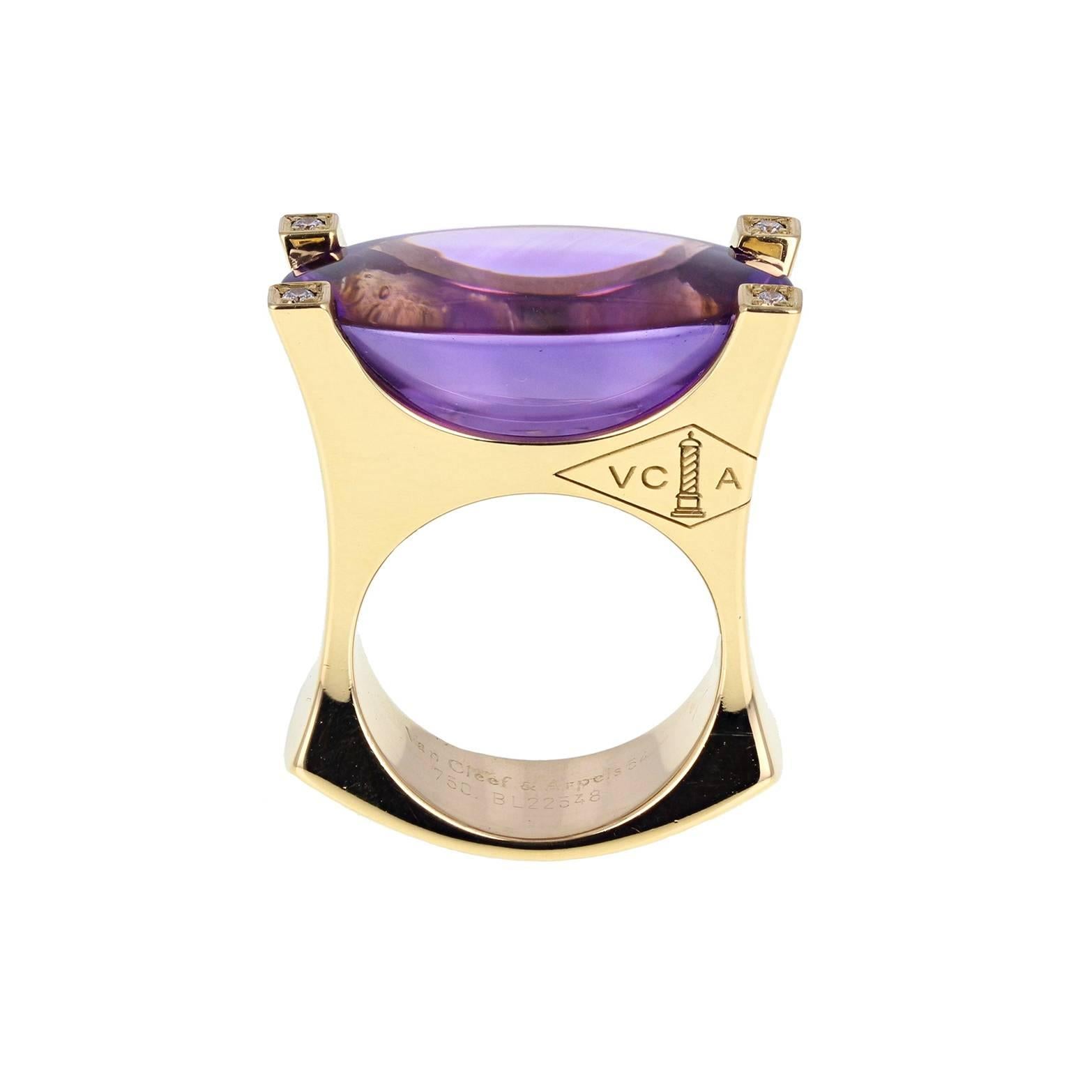 A bold cocktail ring by Van Cleef & Arpels. The central 25 carat oval cabochon amethyst mounted in four heavy claws, each claw set with a single brilliant-cut diamond. VCA logo engraved to the side of the squared shank. Signed VCA and numbered. With