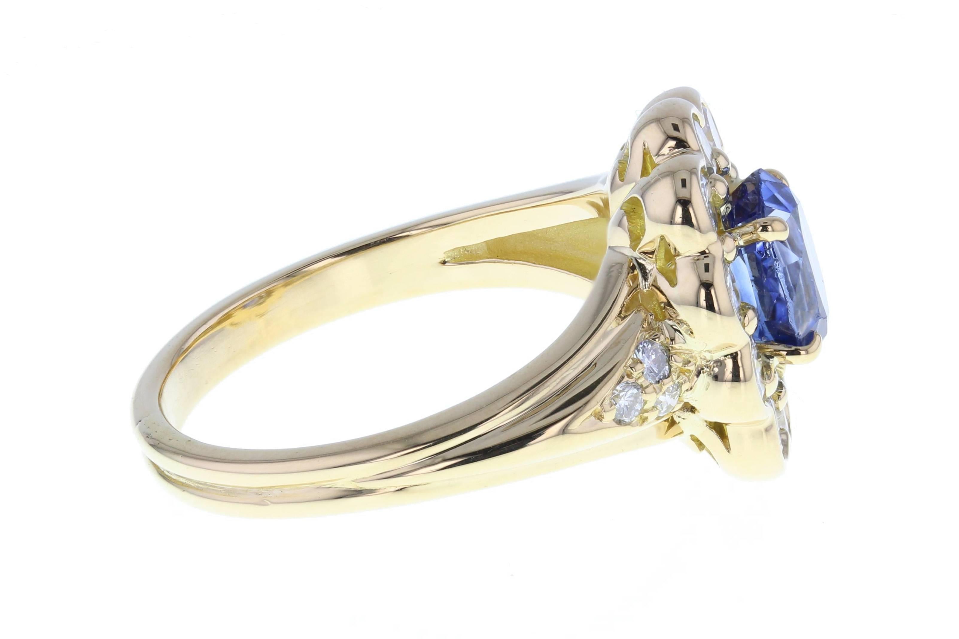 The central oval-cut sapphire exhibits a stunning blue colour with lilac tones. The exceptionally coloured sapphire is mounted in four discreet claws and surrounded by 10 round, brilliant-cut diamonds in a rub-over setting. Some diamond detailing to