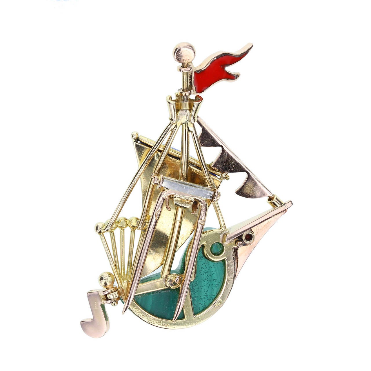 A whimsical and fun brooch by Cartier in the form of a sailing ship. Fashioned from 18 carat yellow gold and featuring geometric shapes of malachite, lapis lazuli, coral and enamel. Signed Cartier Paris, French hallmark.