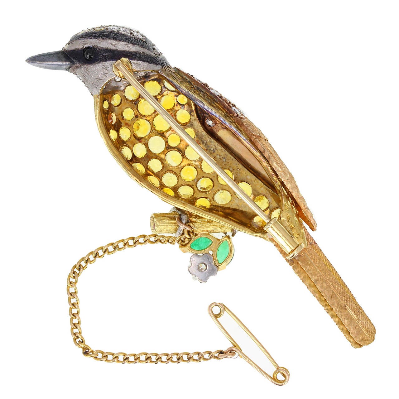 Crafted in 18 carat yellow and rose gold in the form of a bird. Breast pave-set with 10 carats of round brilliant-cut yellow sapphires of well matched colour and body and head set with 1.50 carats of round brilliant-cut diamonds. Fine feather
