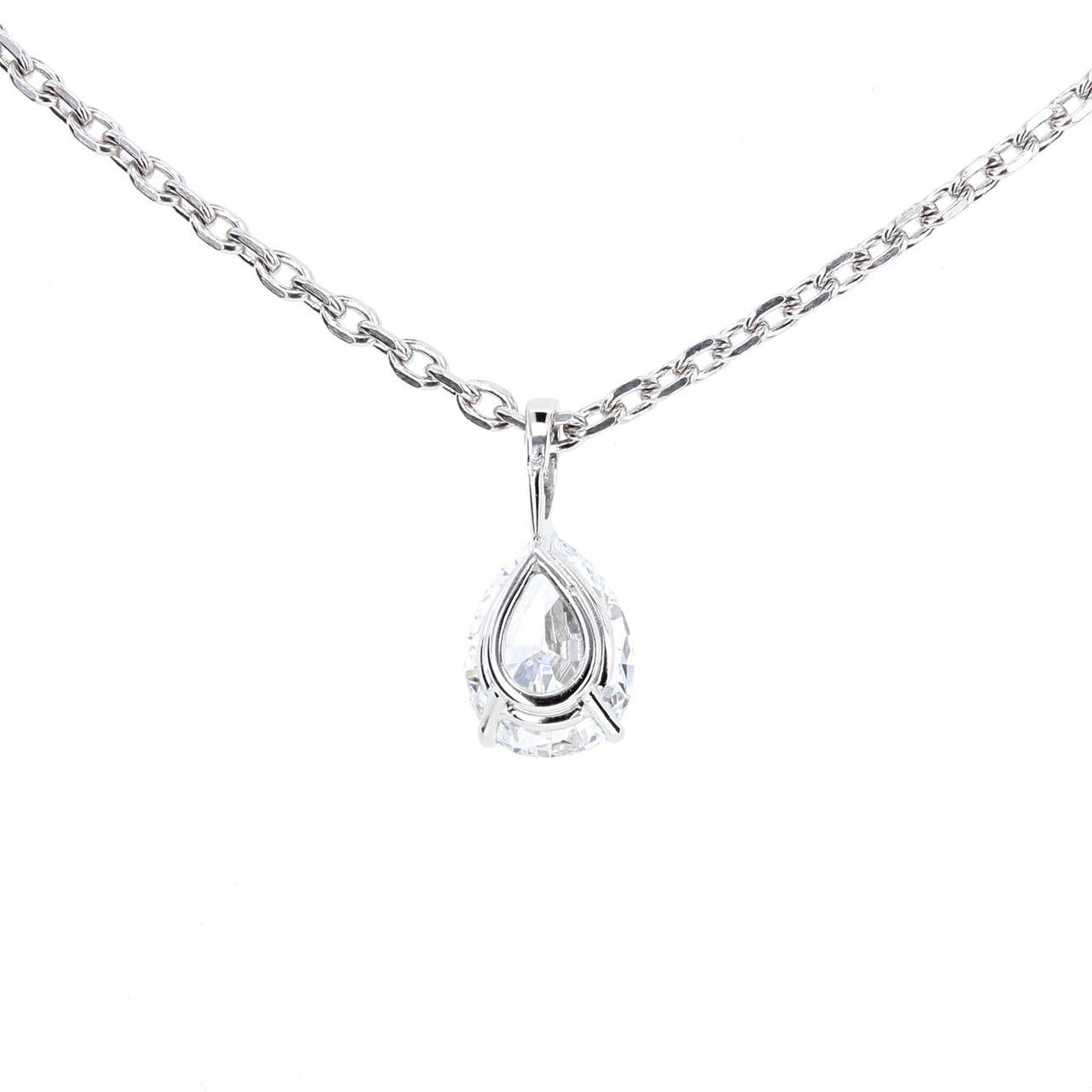 Certificated by HRD this exceptional pear brilliant cut diamond weighs 1.78 carats. E colour and VVS1 clarity makes this diamond rare quality. Mounted in three simple platinum claws and suspended from a 44cm platinum belcher style chain. Chain can