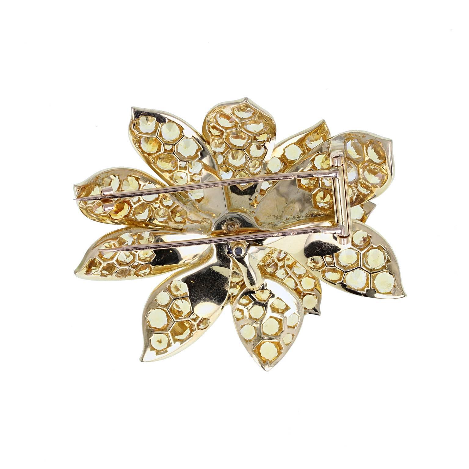 A fine and impressive brooch fashioned as a blossoming flower, pave set with round, brilliant-cut citrines. High quality and beautifully formed. French assay marks.
 
Setting
Tests as 18 carat gold
 
Citrine
Weight: 13.00 carats
