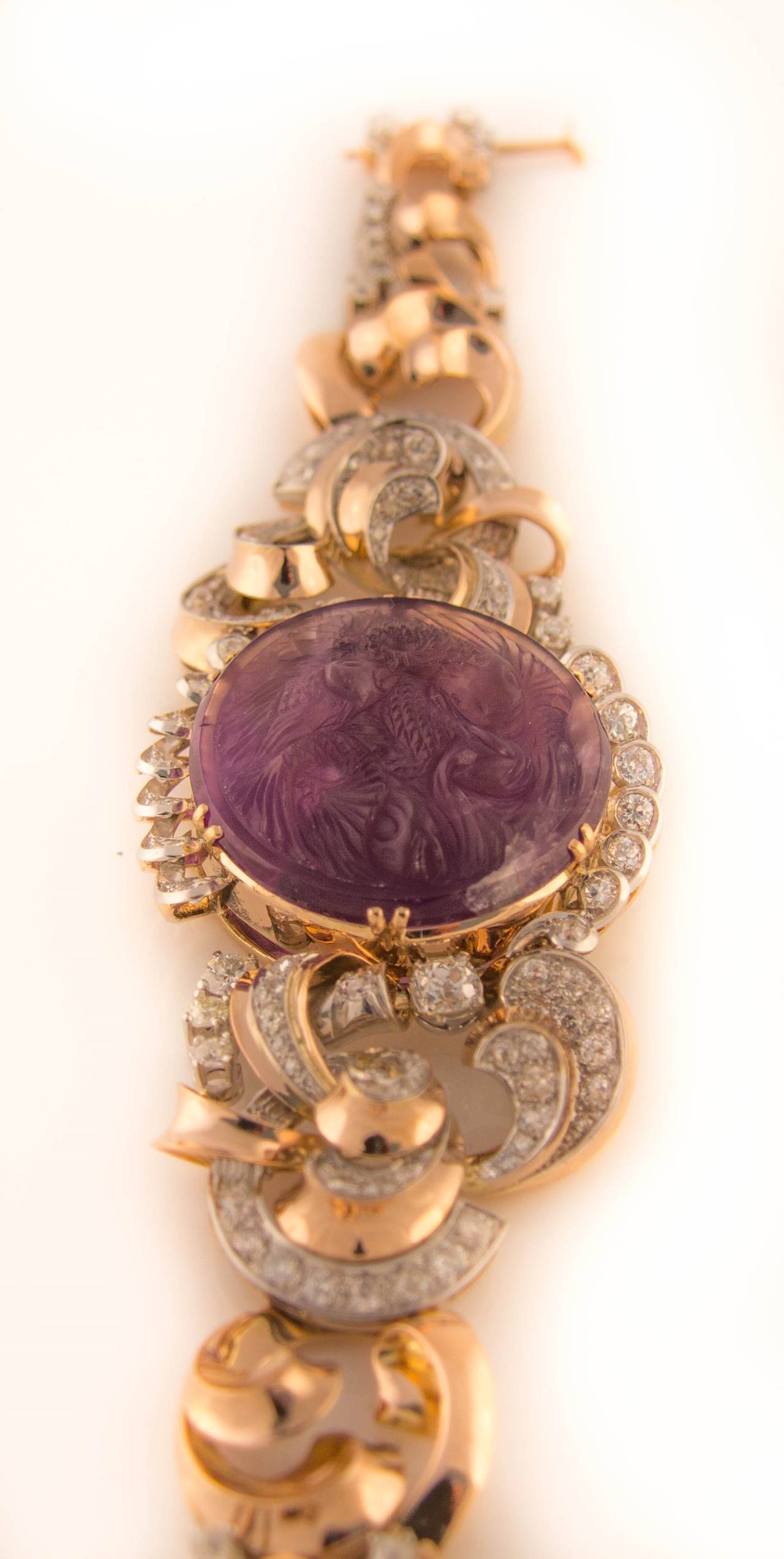Stunning 1940s bracelet beautifully set with diamonds in various cuts and a carved amethyst showing two Koi carps.
