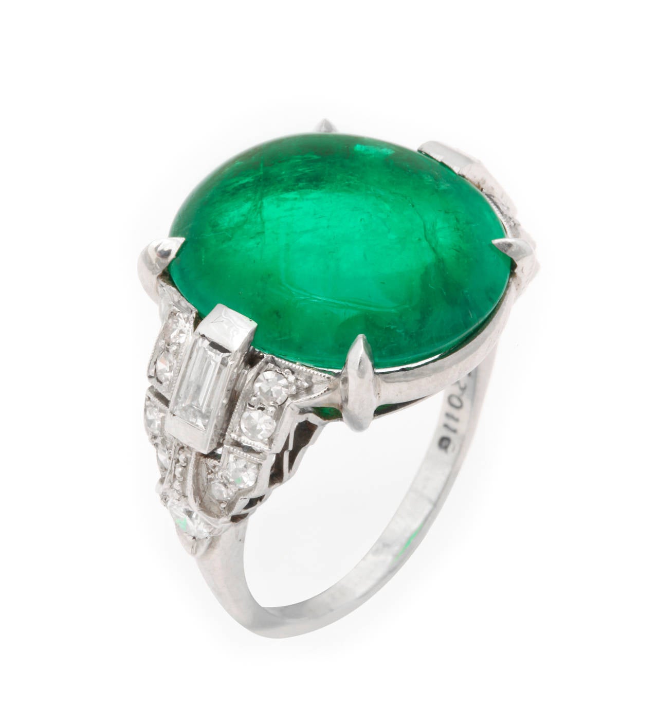 J.E. Caldwell Art Deco ring is set with a cabochon emerald, diamonds, and 18K white gold. 

Estimated diamond weight: 1.70ct

Estimated emerald weight: 15.70ct

Ring size: 9