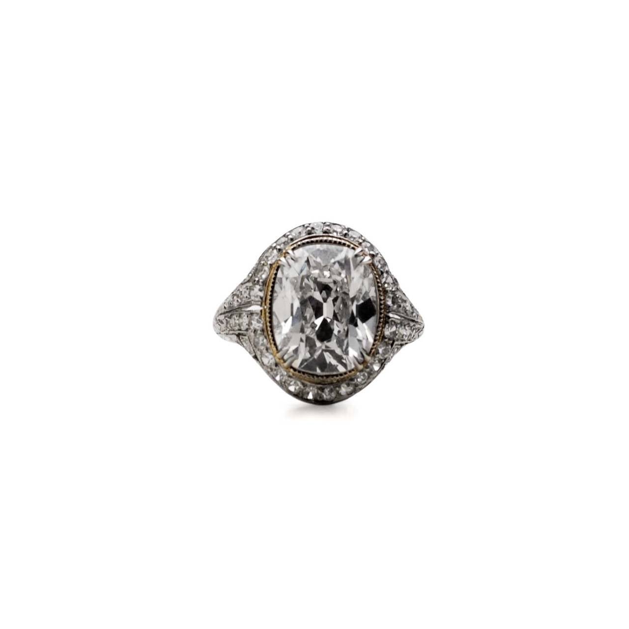 J.E. Caldwell Deco Platinum Ring, Old Mine Cut Diamond. 

Estimated weight of F color / VS2 diamond: 5.57ct
Estimated weight of single cut diamonds: 0.65ct