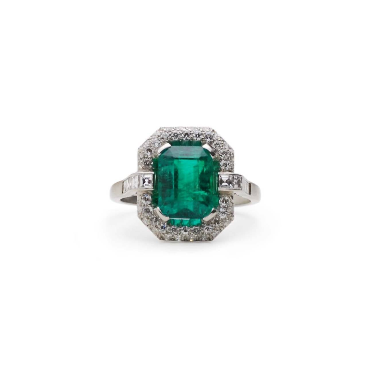 Platinum Art Deco Diamond & Emerald Ring

Estimated diamond weight: 1.00ct
Estimated Columbian Emerald (no oil) weight: 3.12ct

Columbian Emerald comes with cert.