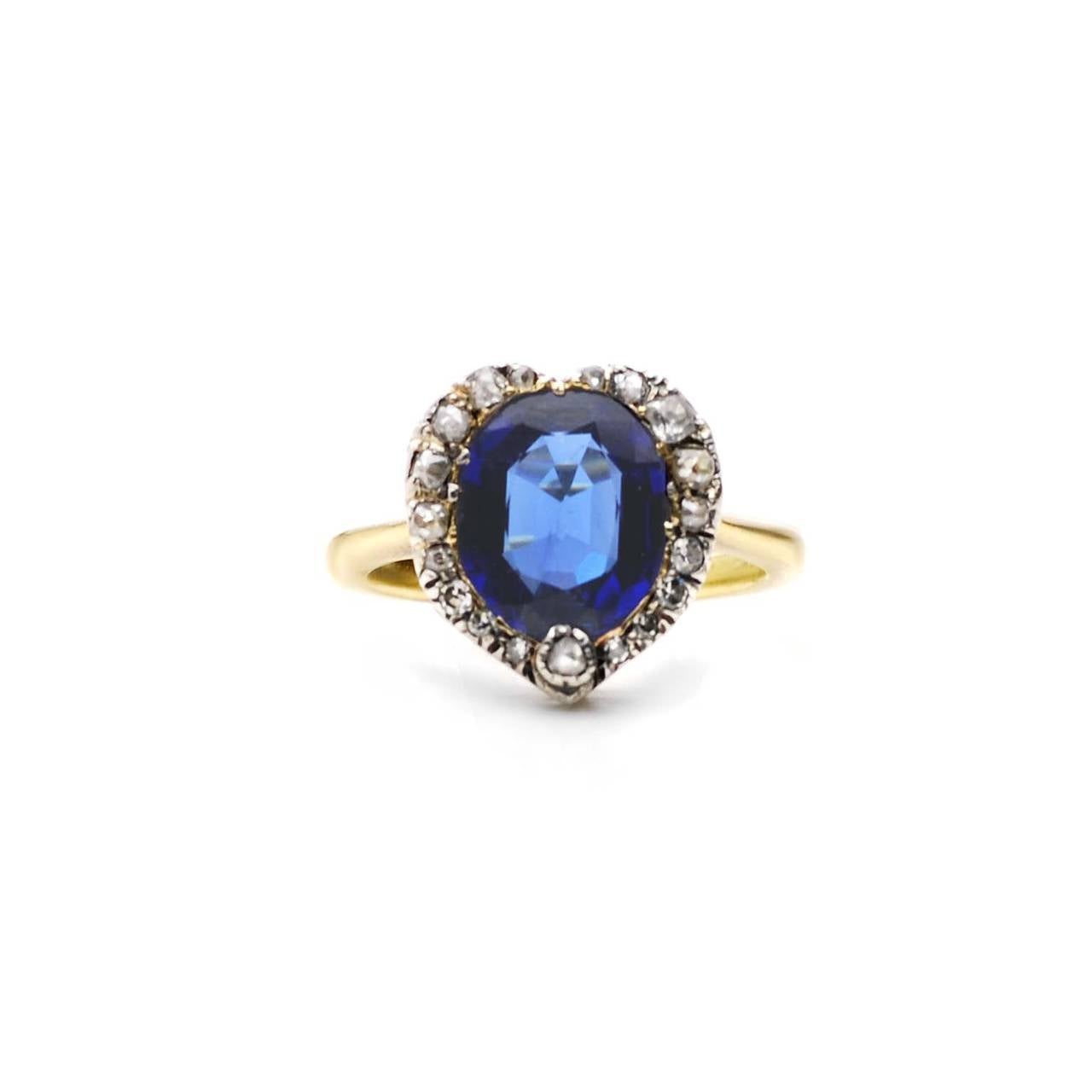 Edwardian Sapphire Ring set in 18K gold and silver. 

Estimated rose cut diamond weight: 0.32ct
Estimated cushion Burma sapphire weight: 3.00ct