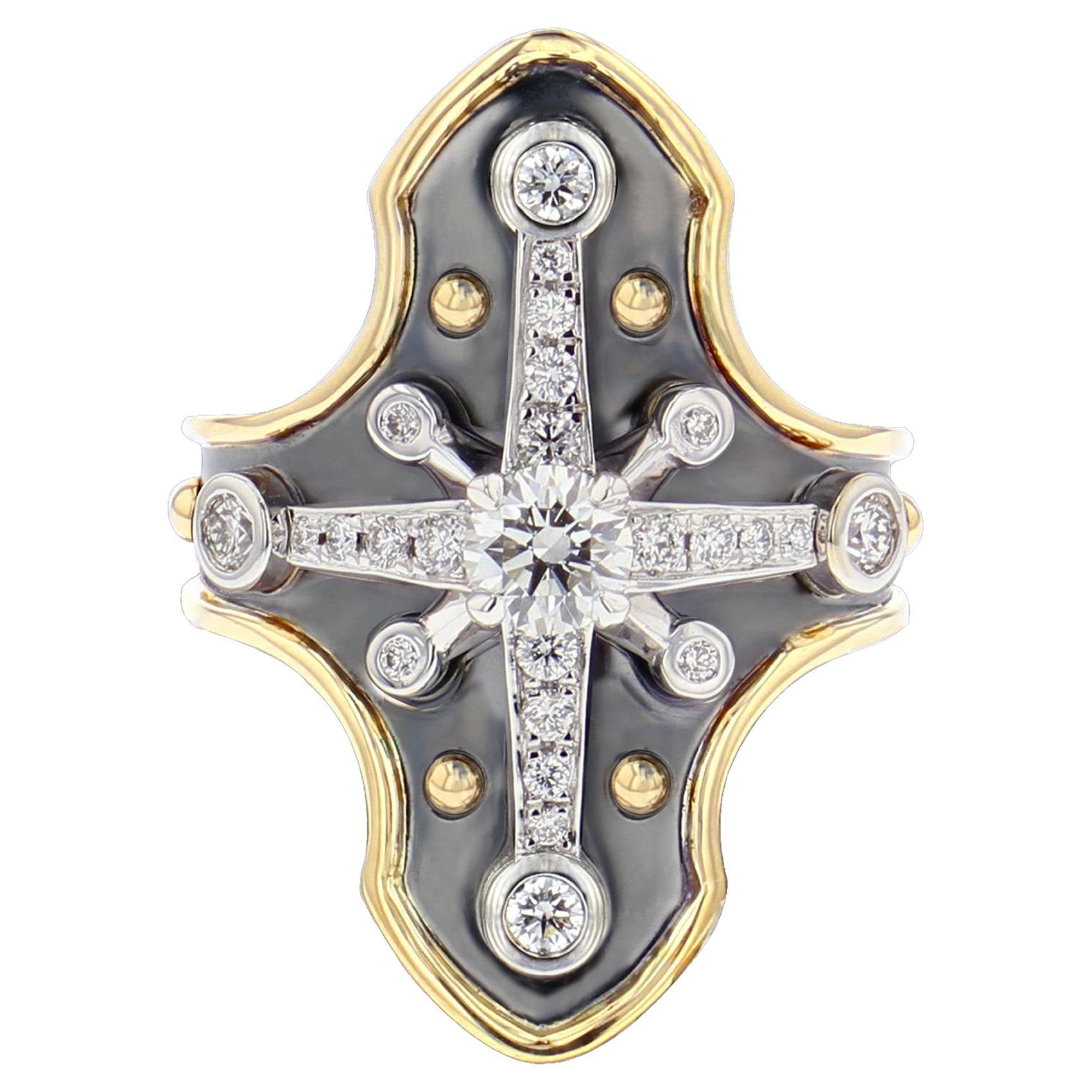 Yellow gold and distressed silver ring studded with a diamond surrounded by diamonds set on a white gold star.

Details:
Central Diamond: 0.37 cts
24 Diamonds : 0.38 cts 
18k Gold : 5 g 
Distressed Silver : 3.5 g
Made in France