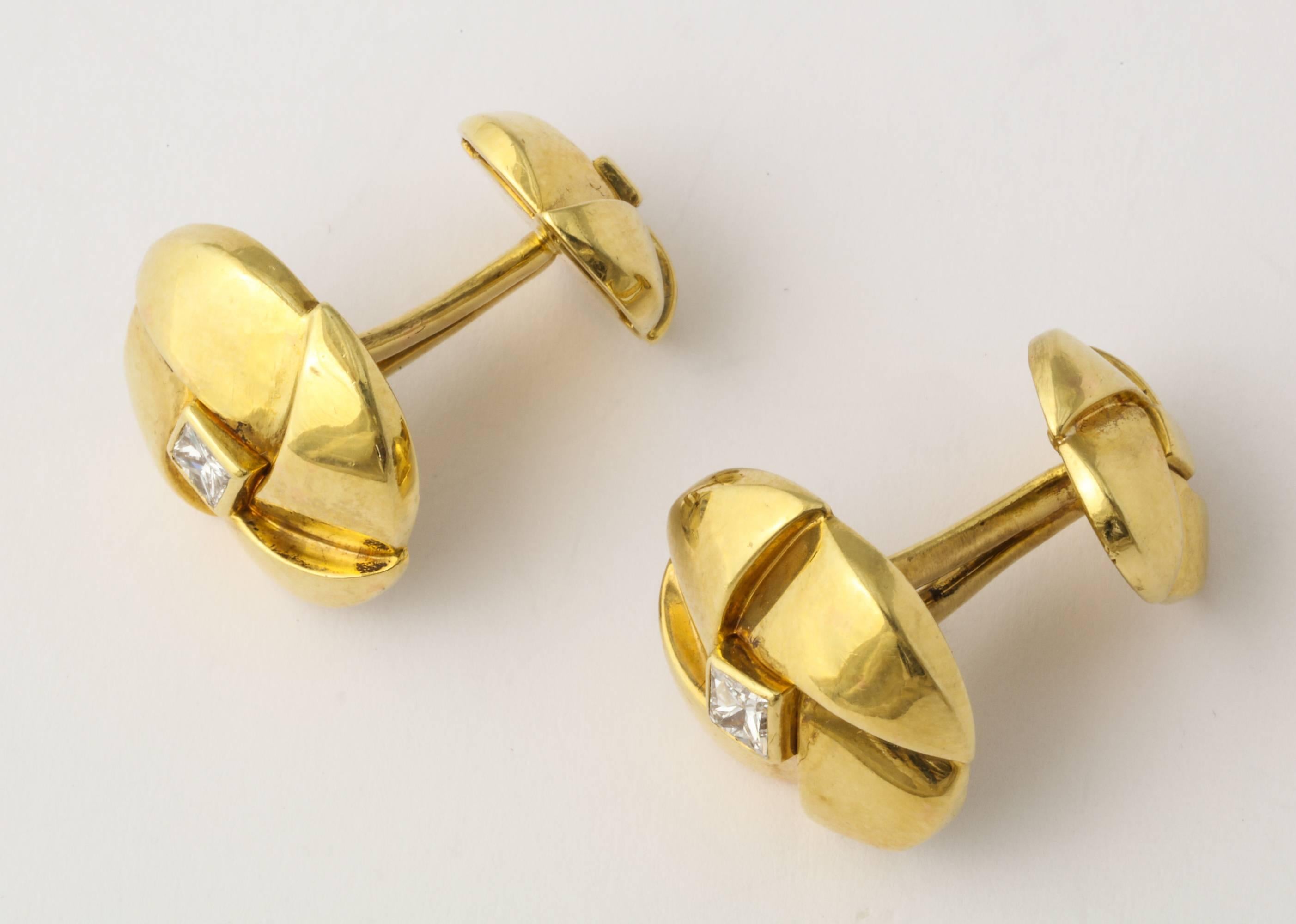 A handsome pair of Jose Hess cuff links of 18K gold, set with square cut diamonds. .855 grams. 3/4 inches Diameter. Gold, and Jose Hess marks.