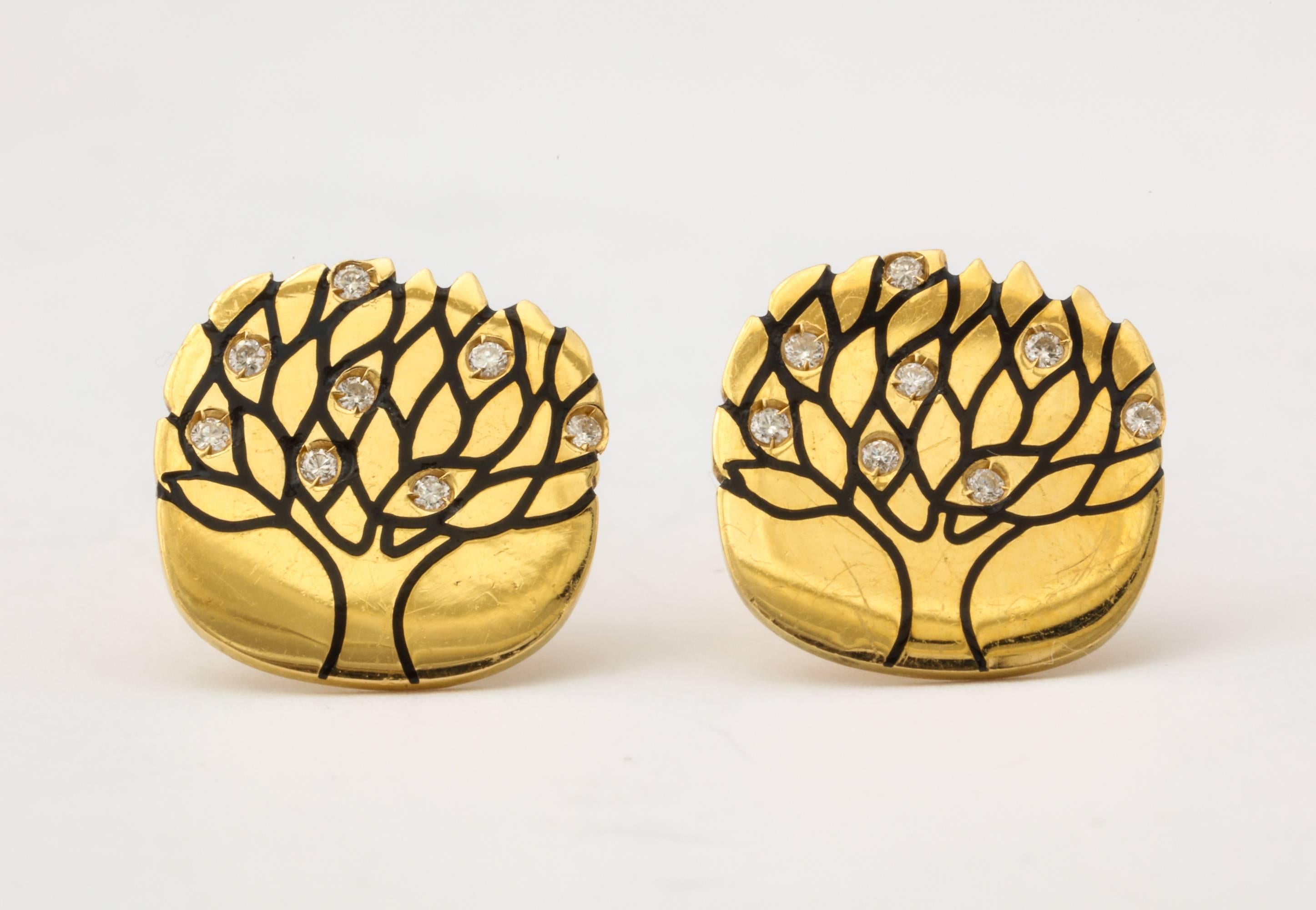Beautifully graphic rounded square 18K gold cufflinks, the low relief image of stylized fruit trees detailed in black enamel, with the subtle  spark of scattered diamonds. 1/2 inch diameter, Italian gold and registry marks.