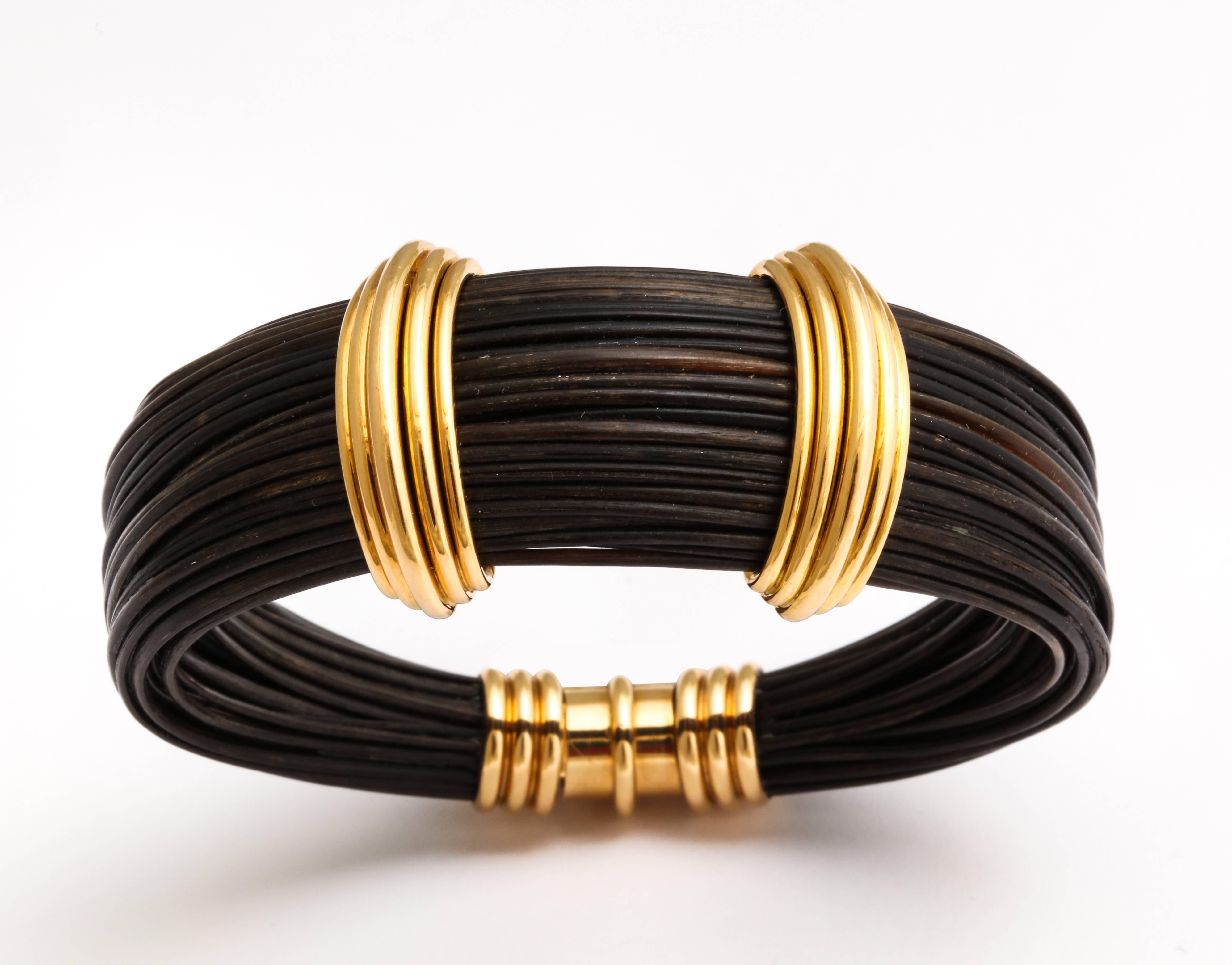 Harking back to the glamorous nights at New york's Studio 54 this 1970's Paul Binder necklace and bracelet are as fresh and fashionable as they were decades ago, beautifully crafted of 18K gold and ebony colored elephant hair. Necklace 1 x 13 1/2