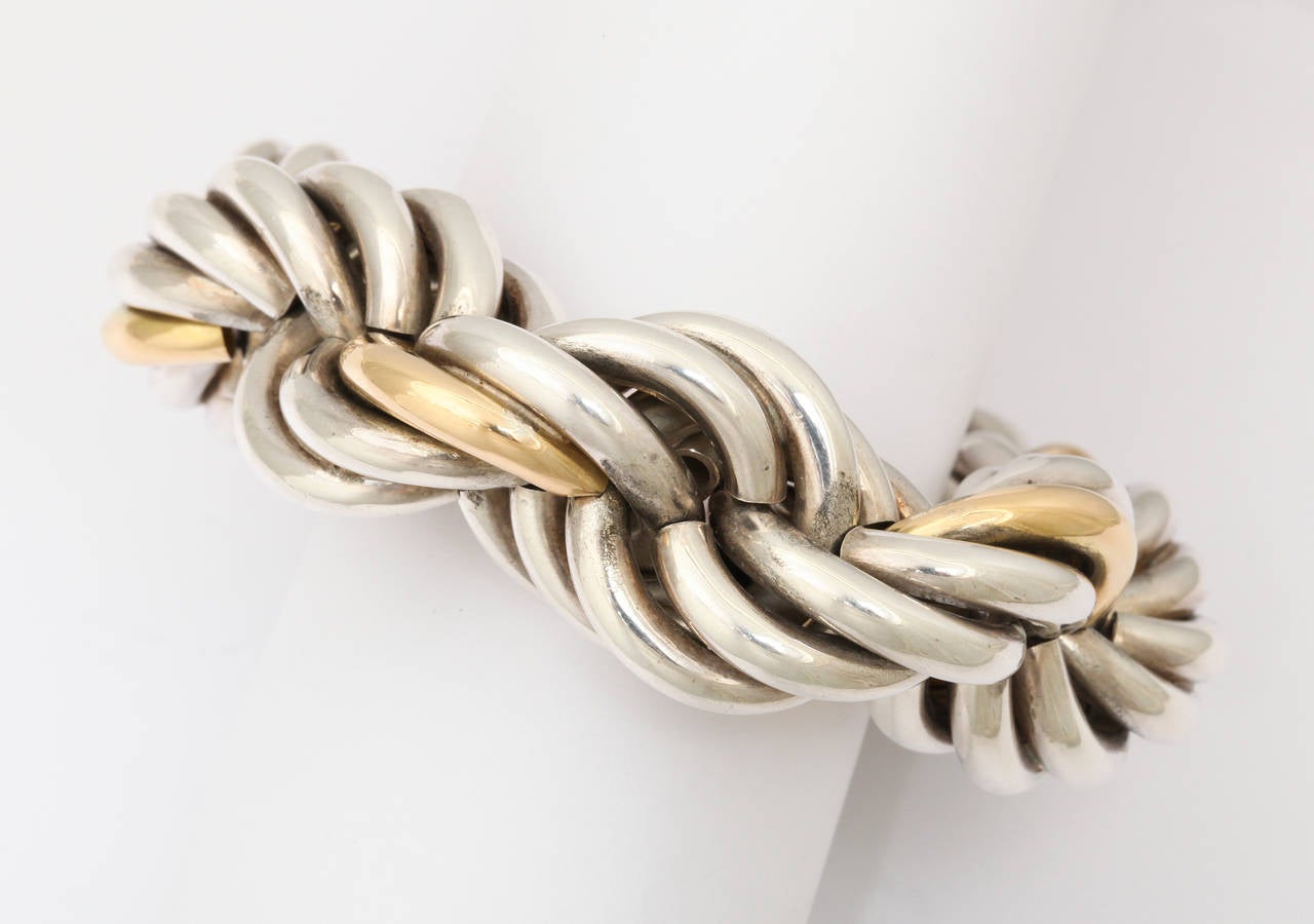 Massive and spectacular rope bracelet made in Italy in the 1970s for Tiffany & Co. One gold strand wraps through the links and the large scale toggle closure make  this a fashion accessory beyond chic. 10 1/2 inches long, but because of it's girth