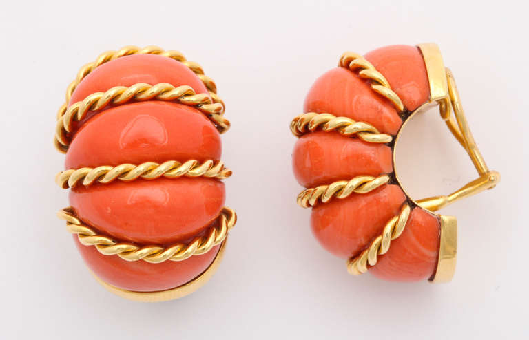 We are pleased to offer the largest version of this classic Seaman Schepps earring, in carved natural coral and 18KT gold. On the back: Registry numbers, 750, Seaman Schepps and the shell marks. Schepps no longer has access to  natural coral for