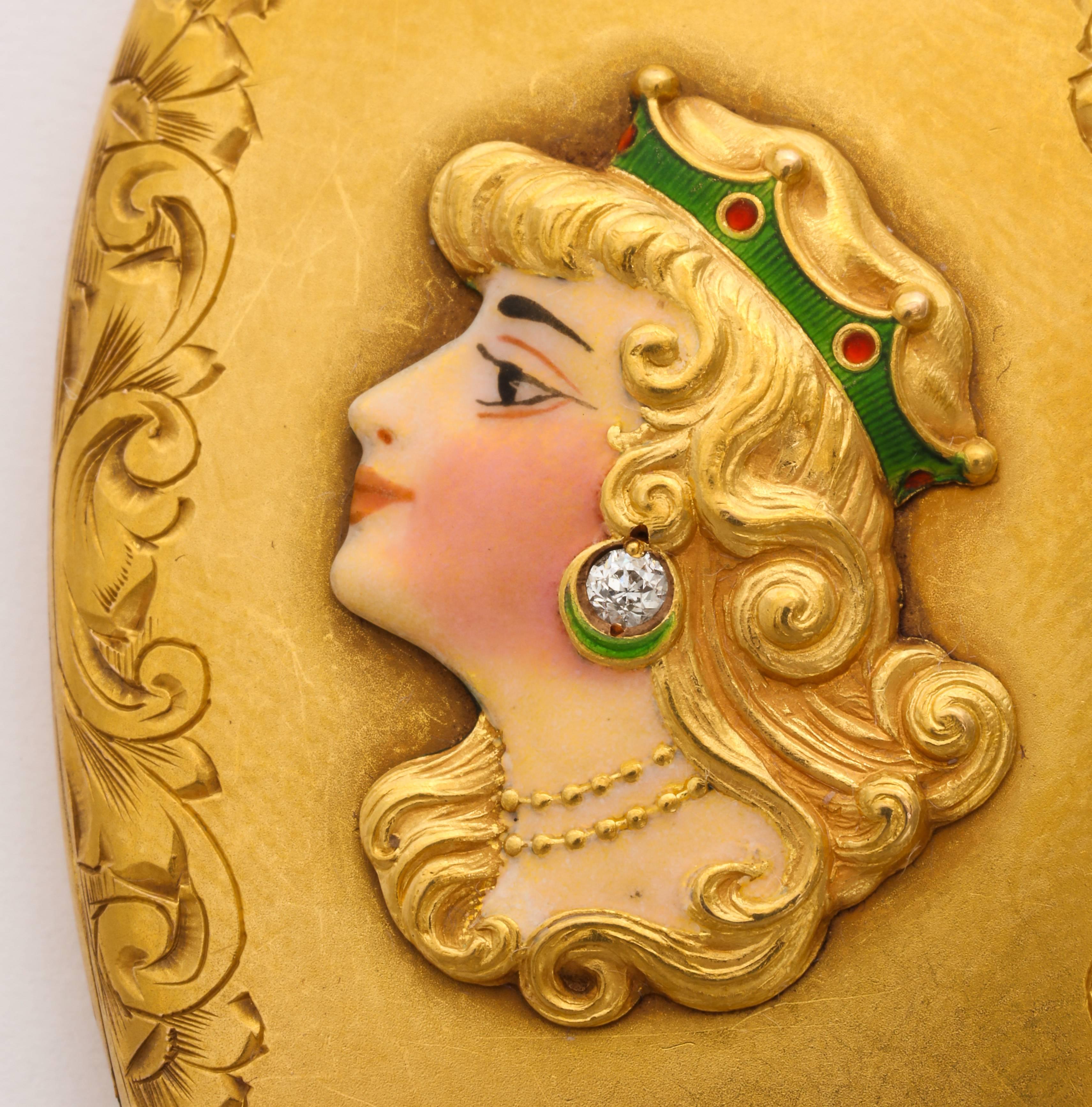 We offer this perfectly beautiful American Art Nouveau locket of 14K gold with edge engraved flowers and flourishes framing a 3-dimensional female image with diamond earring and enameled crown. The skin tone and blushed cheek is of a particular