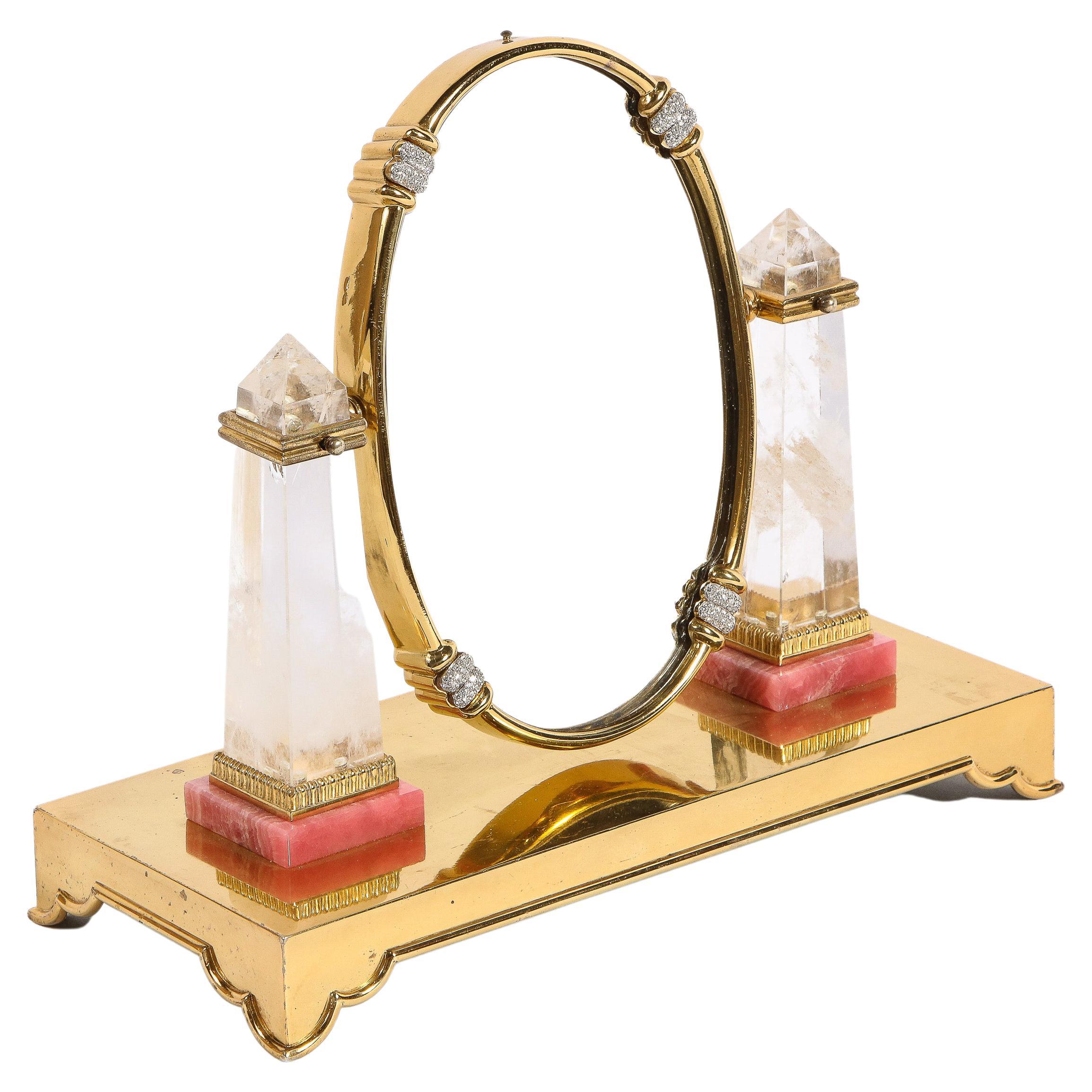 An Exquisite Italian Silver-Gilt, Diamond, Rock Crystal, and Rhodochrosite Vanity Mirror, by Moba Italy.

Circa 1950

Very fine and impressive vanity mirror made in solid sterling gilt, with two rock crystal obelisks, mounted to rhodochrosite. 8