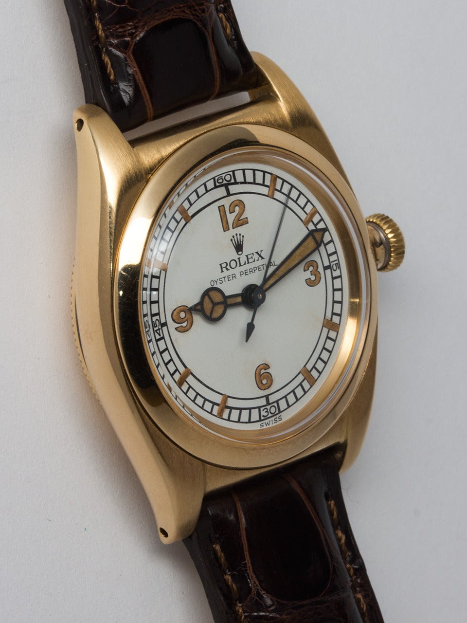 Rolex 14K Yellow Gold Bubbleback Wristwatch, Ref. 3131, circa 1939. 32 x 40mm tonneau Oyster case with smooth bezel and screw down period style crown. Featuring beautifully restored white dial with Arabic numerals and baton indexes, matching