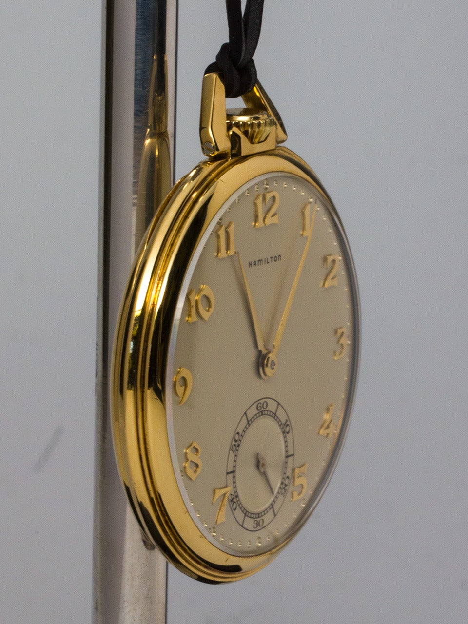 Hamilton 18K yellow gold open face dress pocket watch, circa 1940s. 12-size pocket watch with open face, featuring beautiful condition original two-tone silvered satin dial with applied yellow gold stylized Arabic numerals and gold hands. Powered by
