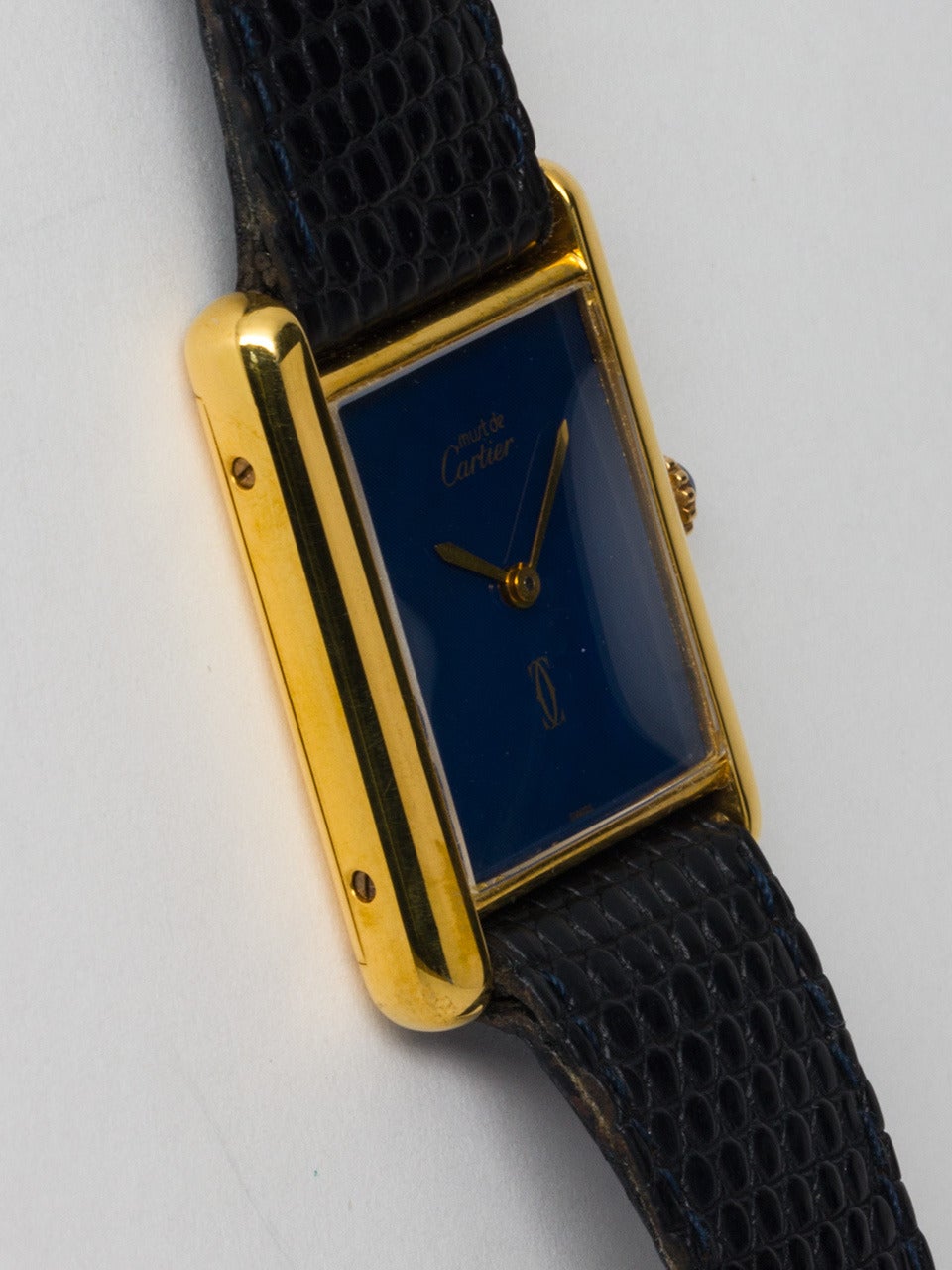 Cartier Man's Vermeil Must de Cartier Tank Louis wristwatch, circa 1980s. Vermeil, 20 microns gold over silver, 23.5 X 31mm case secured by four screws. Lovely blue painted dial signed Must de Cartier, with gilt hands. Powered by a 17-jewel