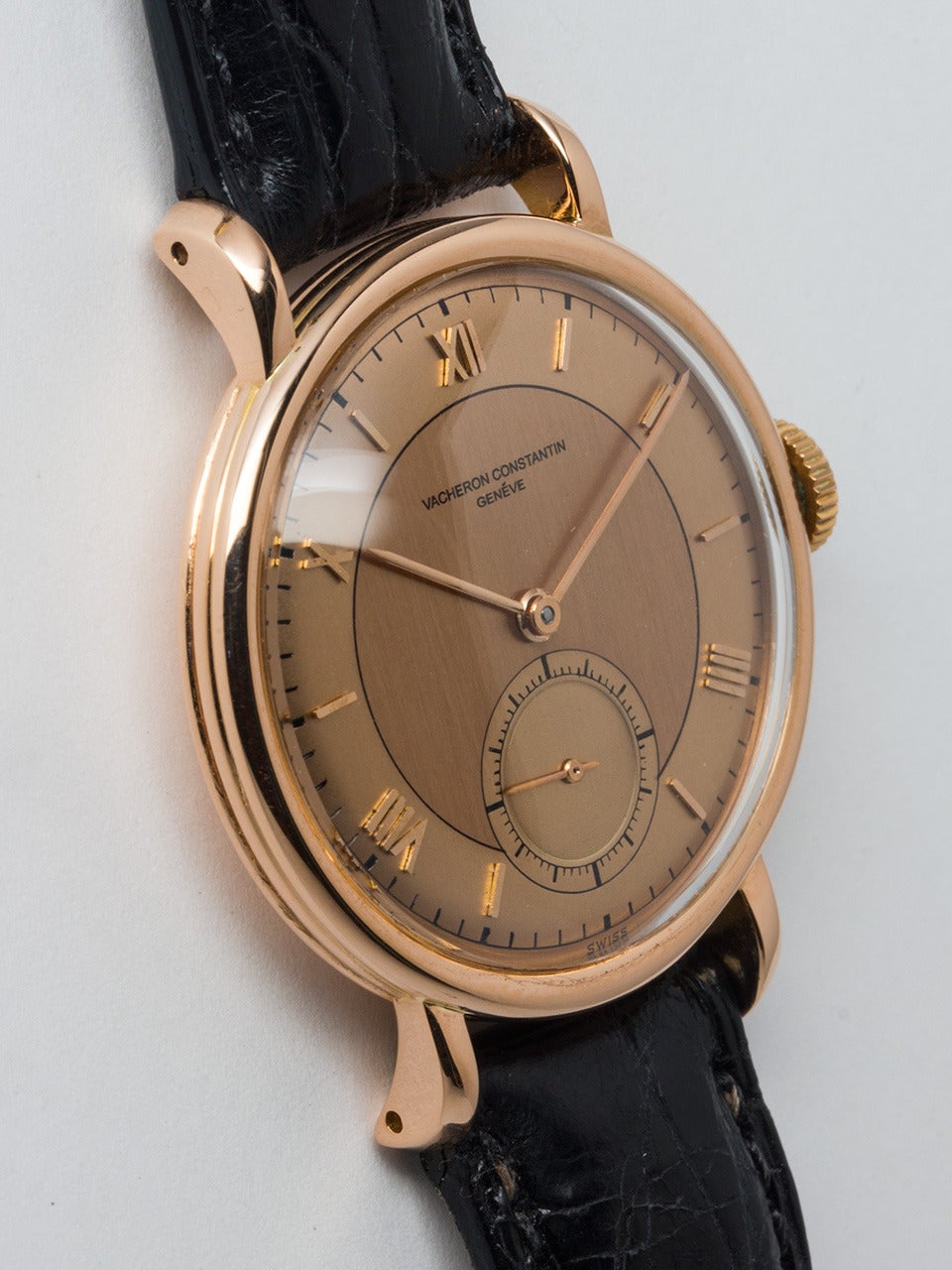 Vacheron & Constantin 18K Rose Gold Wristwtach, Ref. 453/2C, circa 1950s. 35mm heavy snap-back case. A beautifully restored salmon dial with raised Roman and baton numerals. Powered by a 17-jewel manual-wind movement with subsidiary seconds. Offered