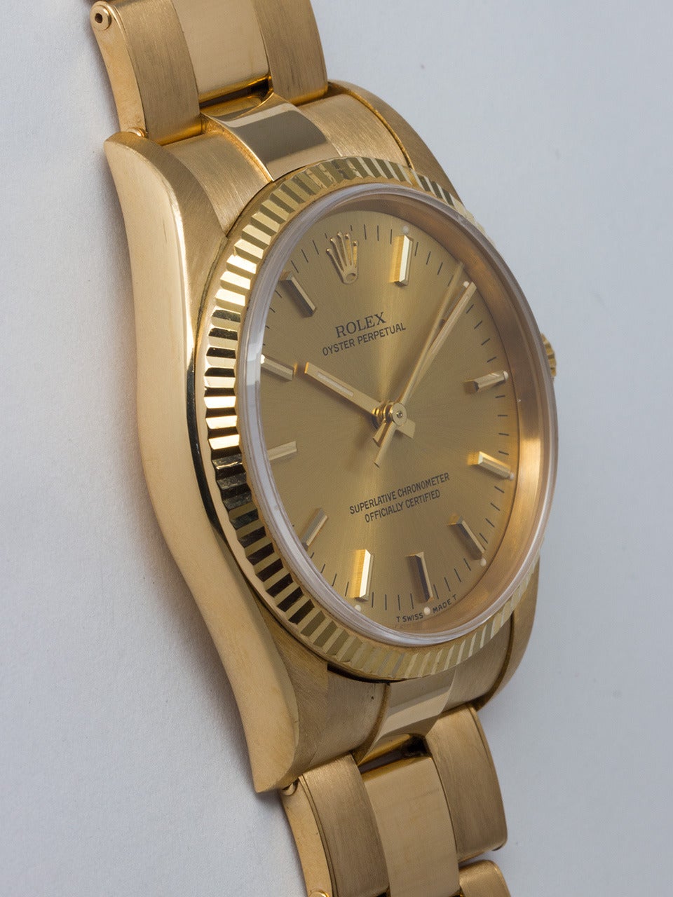 Rolex 18K Yellow Gold Oyster Perpetual wristwatch, Ref. 14238, serial number N3, circa 1991. 34mm diameter case with fluted bezel and sapphire crystal. Original champagne dial with applied gold indexes and hands. Powered by a self-winding calibre