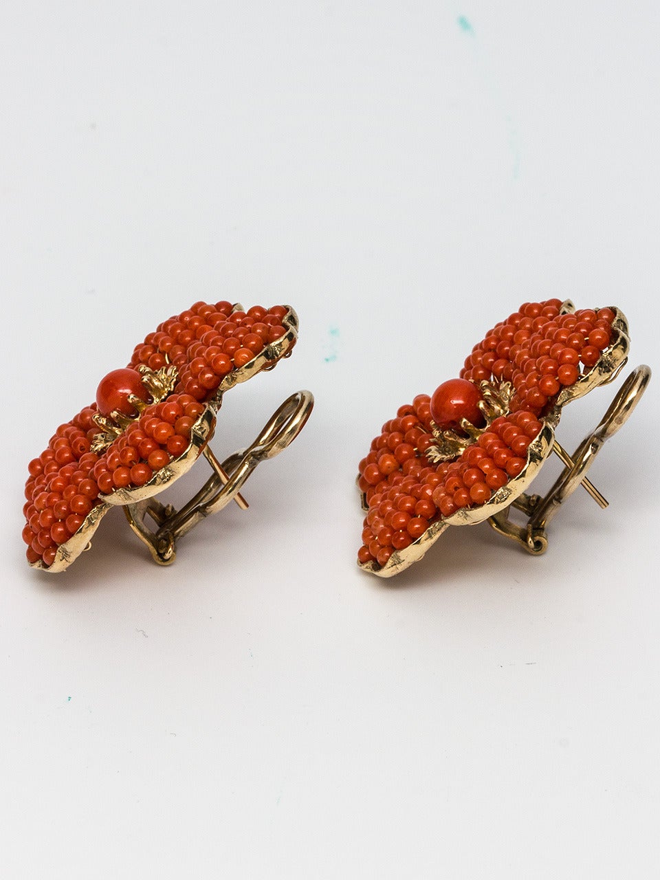Yellow Gold and Coral Flower Earrings. Coral beads strung into petals surrounding a 5mm coral center encased within scalloped gold edges. The back of the earring features a nicely pierced design. Post and clip back closure. Very retro and beautiful