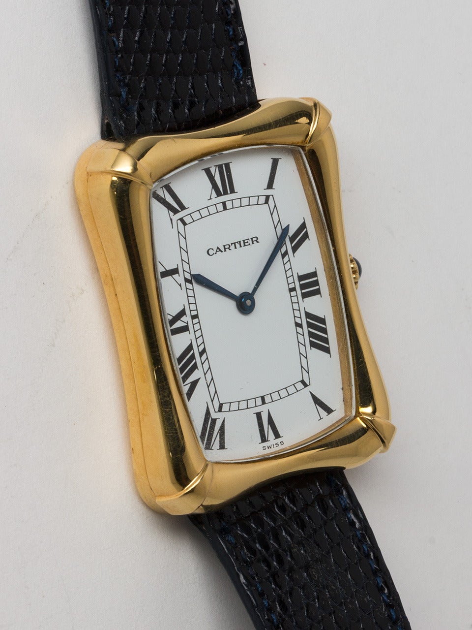 Cartier Yellow Gold Bamboo Tank Wristwatch circa 1973. Large and very distinctive man's model introduced in 1973, measuring 28 x 36mm and 7mm thick. Exceptional condition example with great sculpted design. Very clean original white dial with