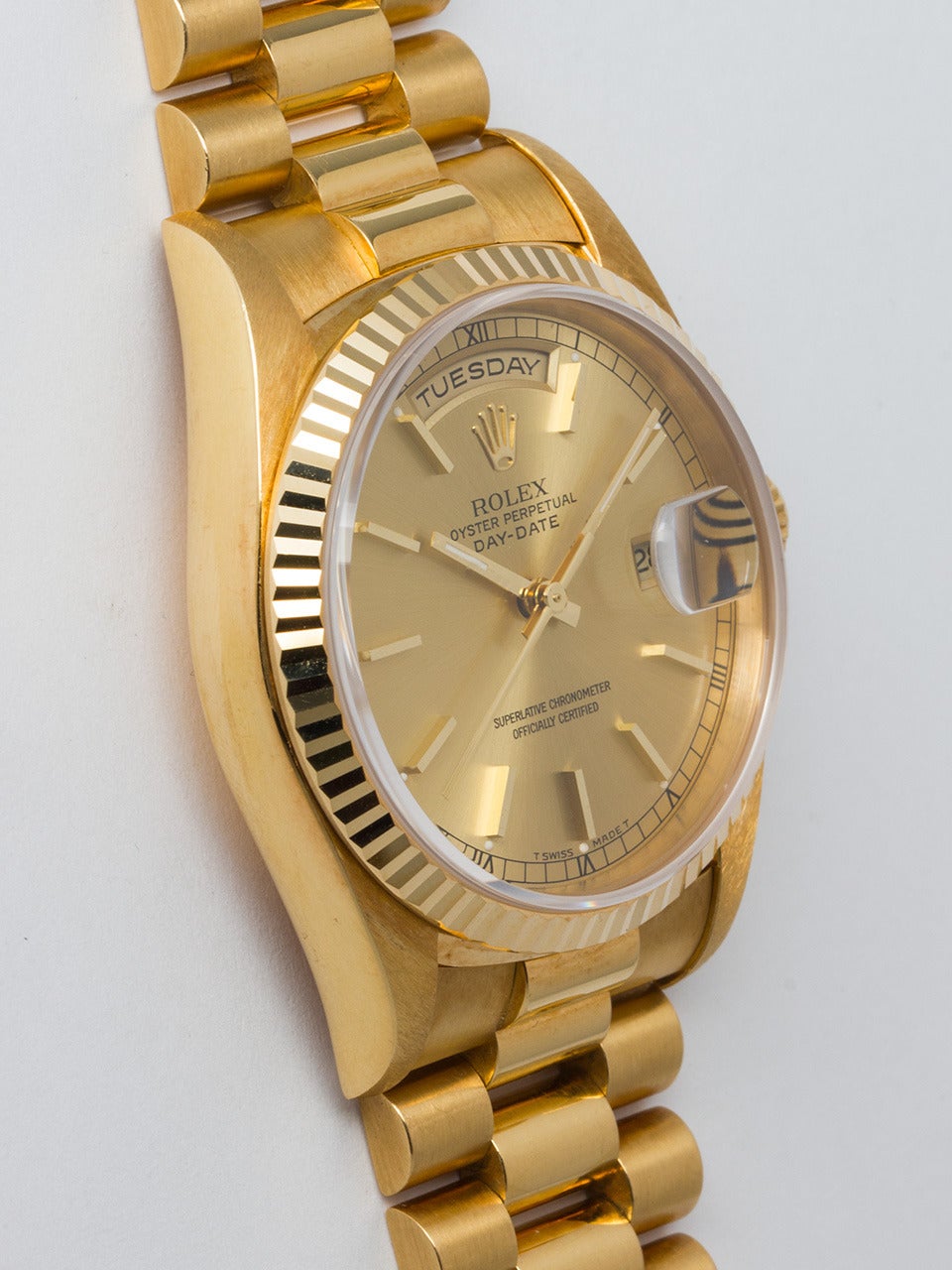 Rolex 18K Yellow Gold Day Date President Wristwatch ref 18238 serial # T4 circa 1998. 36mm diameter case with fluted bezel and sapphire crystal. Original champagne dial with applied gold indexes and hands. Powered by self winding double quick set