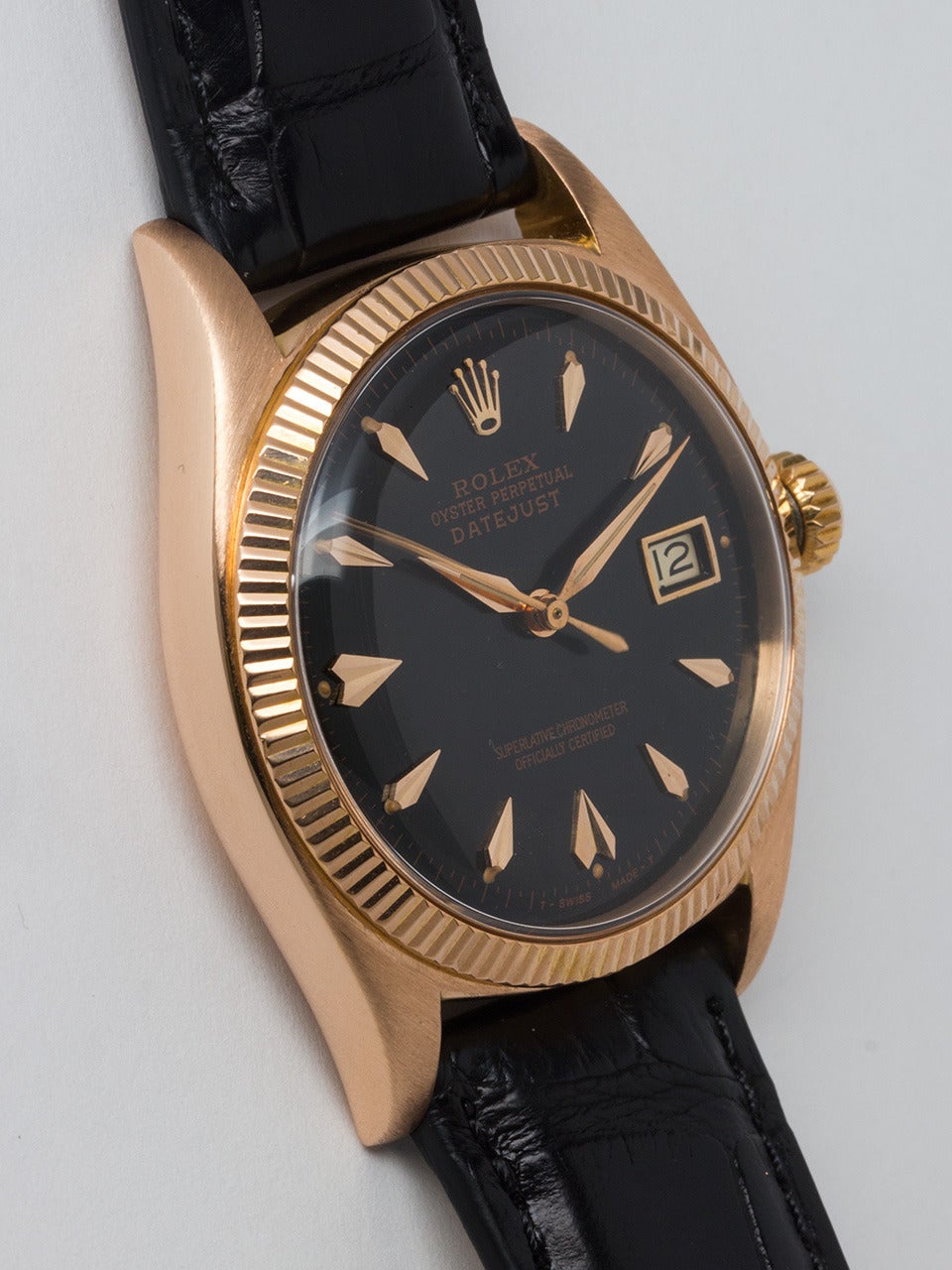 Rolex 18K Rose Gold Datejust Wristwatch ref 6605 serial # 486,xxx circa 1959. 36mm diiameter case with 18K rose gold finely milled bezel with an acrylic dome crystal without date magnifying cyclops for a clean look. Beautifully restored glossy black