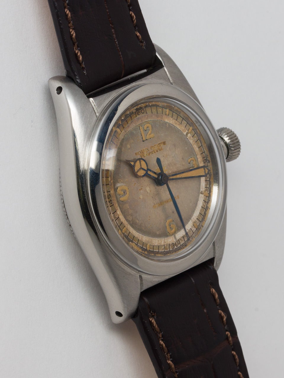 Rolex Stainless Steel Bubbleback Wristwatch ref 1102 serial # 107,xxx circa 1941. Early flat back case pre U.S. distribution model, measuring 31mm. With patina'd and faded, but still very interesting original mirrored track sector dial with luminous