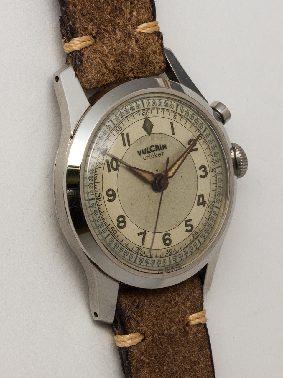 Vulcain Cricket Stainless Steel Alarm Wristwatch circa 1950's. 34 X 42mm case with prominent lugs and heavy snap on back with slots for transmitting sound of alarm. Very pleasing original matte silver 2 tone dial with luminous indexes and tapered