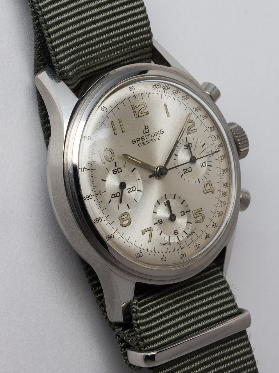 Breitling Stainless Steel Chronograph Wristwatch ref 765 circa 1960s. Large 38mm diameter screw back case with round pushers chronograph. Original silvered satin dial with matching patina'd luminous indexes and hands. Powered by Venus calibre 178