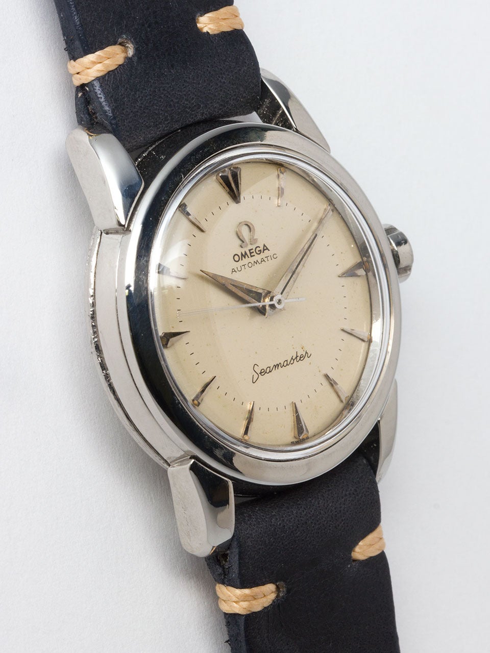 Omega Stainless Steel Seamaster Wristwatch circa 1950s. 31 x 39mm medium size case with wide bezel, heavy snap back case and signed Omega crown. With original matte silvered dial with applied triangular indexes, applied Omega logo, inner minute