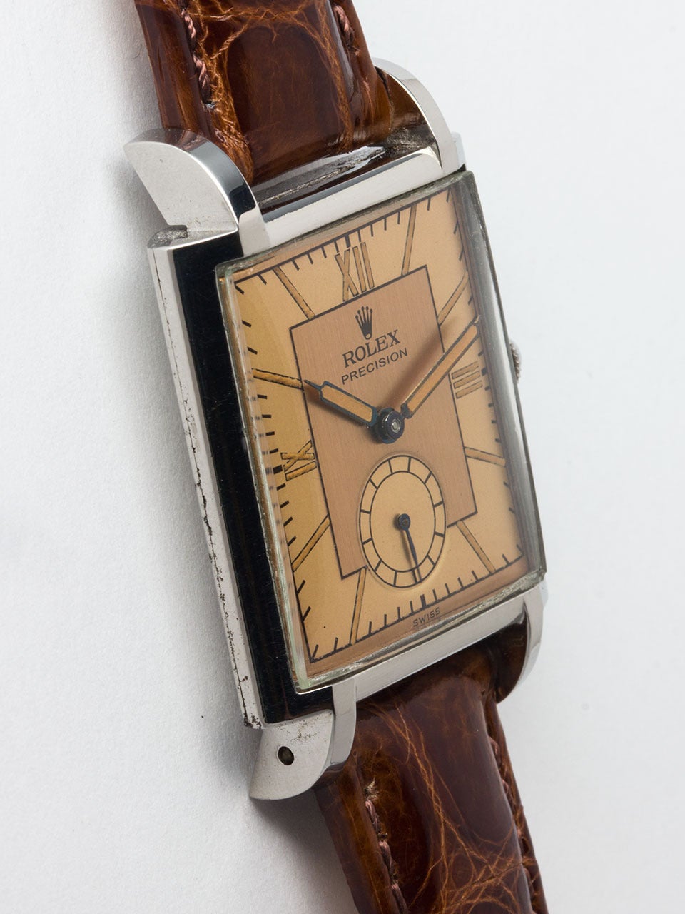Rolex Stainless Steel Rectangular Wristwatch, case ref 4029 circa 1940s. 27 x 40mm snap back case with wide and rounded bezel and extended lugs. With beautifully restored 2 tone antique salmon dial with patina'd luminous Roman figures and matching
