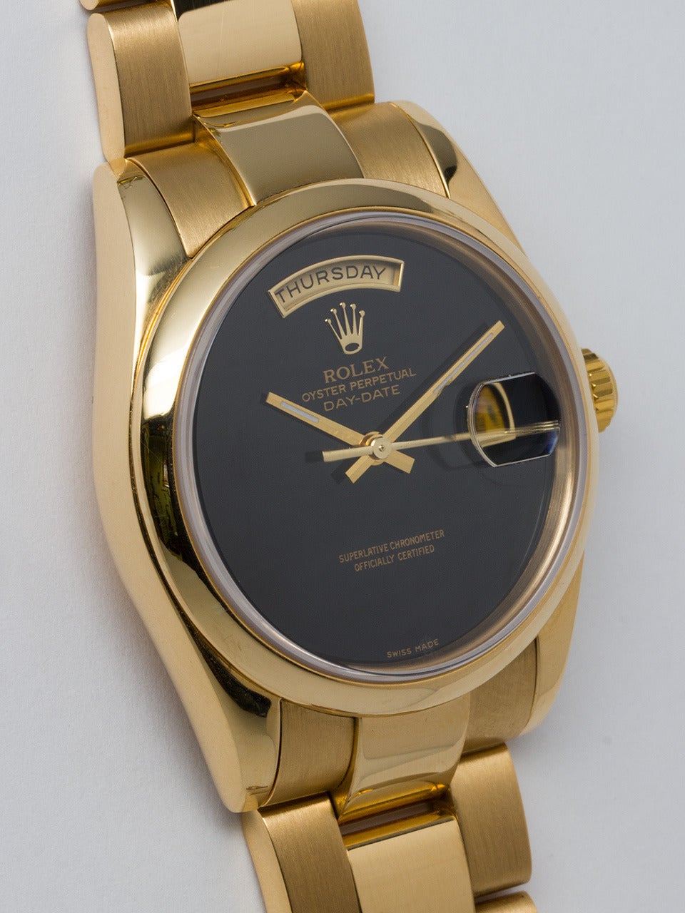 Rolex 18K Yellow Gold Day-Date Wristwatch ref 118208 serial #P5 circa 2000. 36mm diameter Oyster case with smooth dome bezel and sapphire crystal. Rare original factory Onyx dial with gold baton hands. Powered by self winding automatic double quick