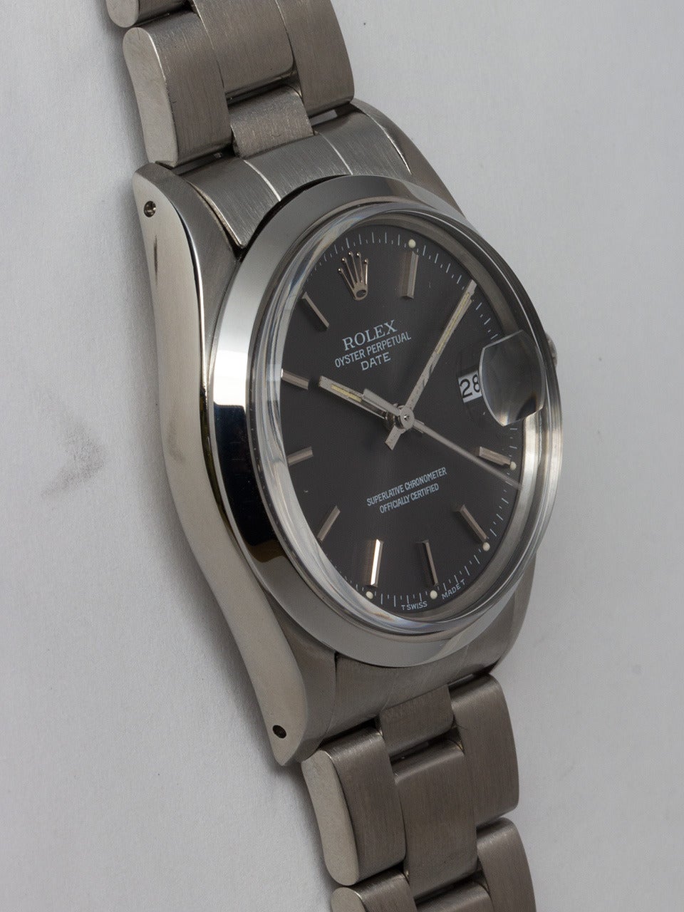 Rolex Stainless Steel Oyster Perpetual Date Wristwatch ref 15000 serial# 7.0 million circa 1981/82. 34mm diameter Oyster case with smooth bezel and acrylic crystal. Lovely original grey dial with silver indexes and hands and white printing on dial.