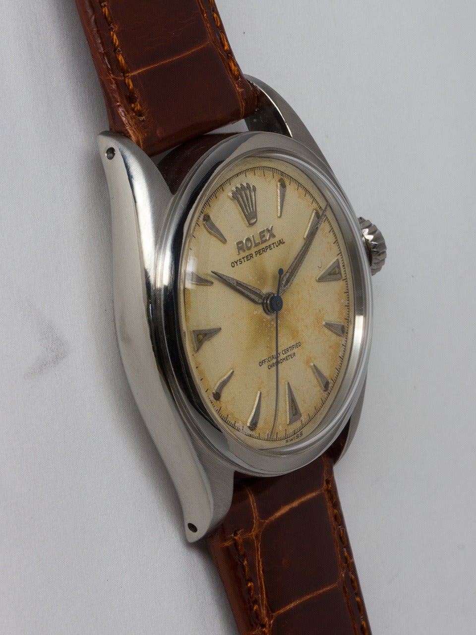 Rolex stainless steel Oyster Perpetual wristwatch, ref 6084, serial# 913,xxx circa 1953. 34mm diameter case with dome bezel and acrylic crystal. Very pleasing original antique white dial with raised silver arrowhead indexes with patina'd luminous