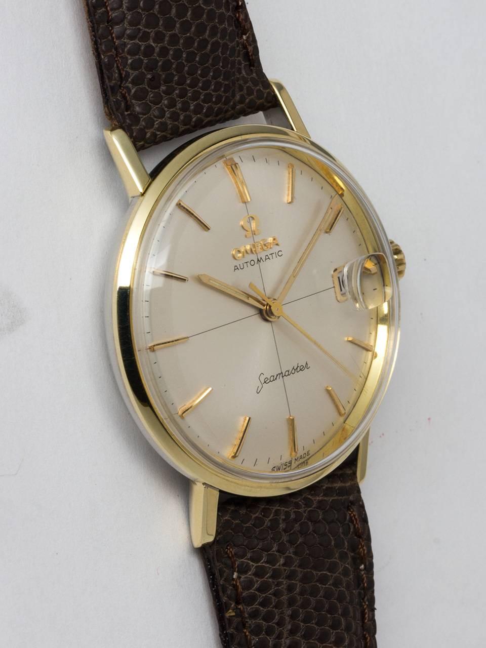 Omega 14K Yellow Gold Filled and Stainless Steel Seamaster Automatic Wristwatch, ref 14730 circa 1960s. Featuring 35 x 40mm gold shell top and stainless steel back with deeply embossed Seamonster logo. Smooth bezel, straight lugs and acrylic crystal