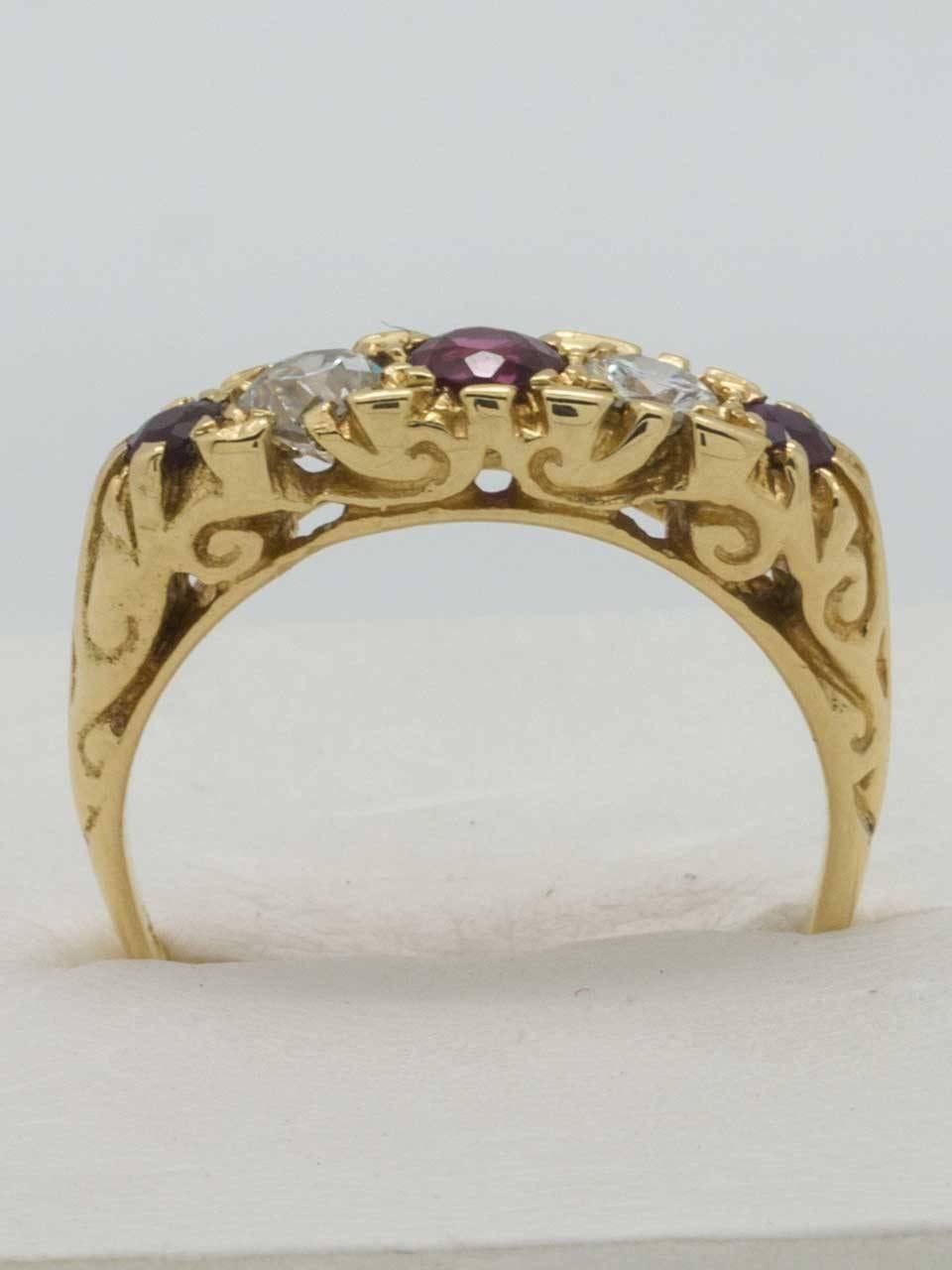 Victorian Era 18K YG ruby and diamond band circa 1900. Very pretty design, classic 5 stone ring with 3 untested old cut rubies alternating with 2 old european cut diamonds. Center ruby is 0.25 approximate carat, 2 side rubies are 0.10 approximate